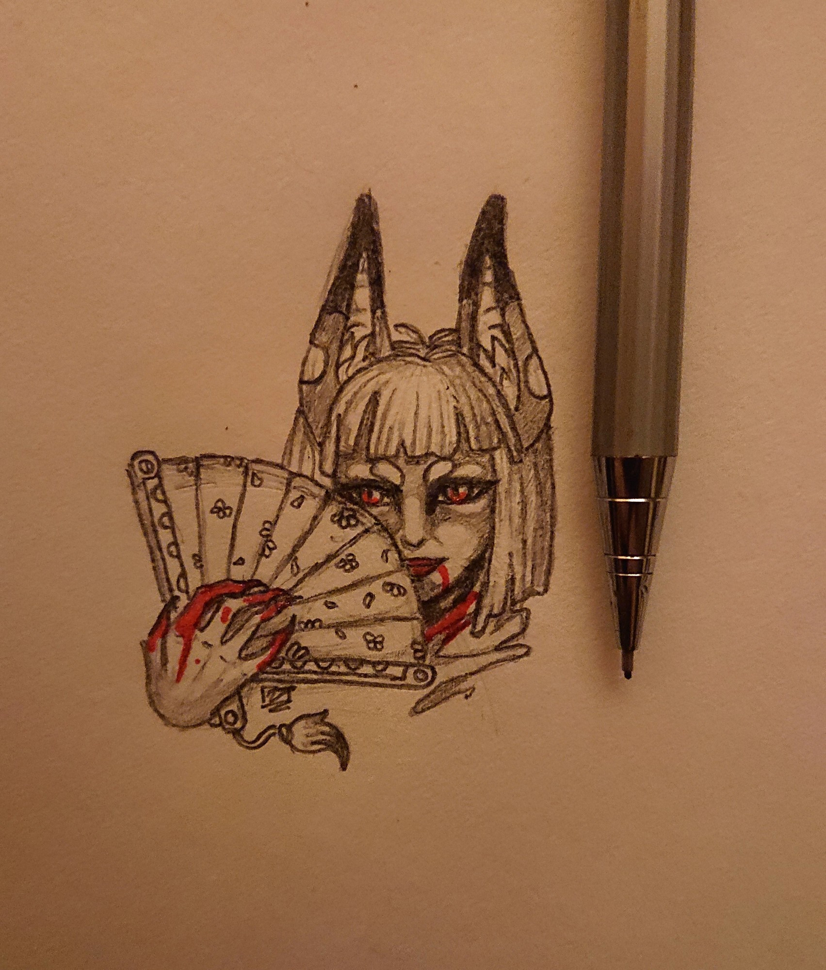 A fox lady holding an open fan partially in front of her face, blood on her chin and fingers, mechanical pencil next to art to show the size.