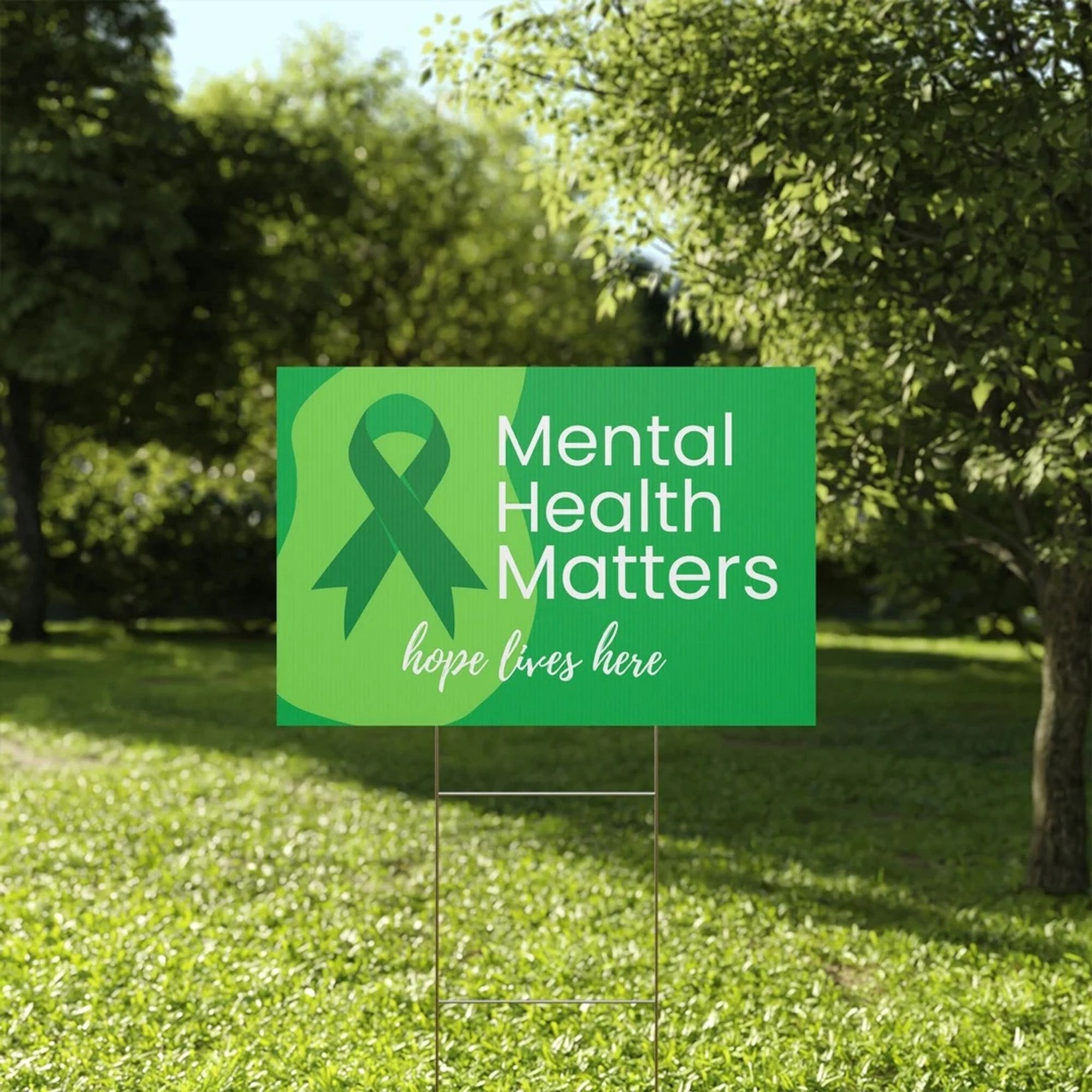 Lawn sign planted in a lawn. Reads: Mental Health Matters. Hope lives here.