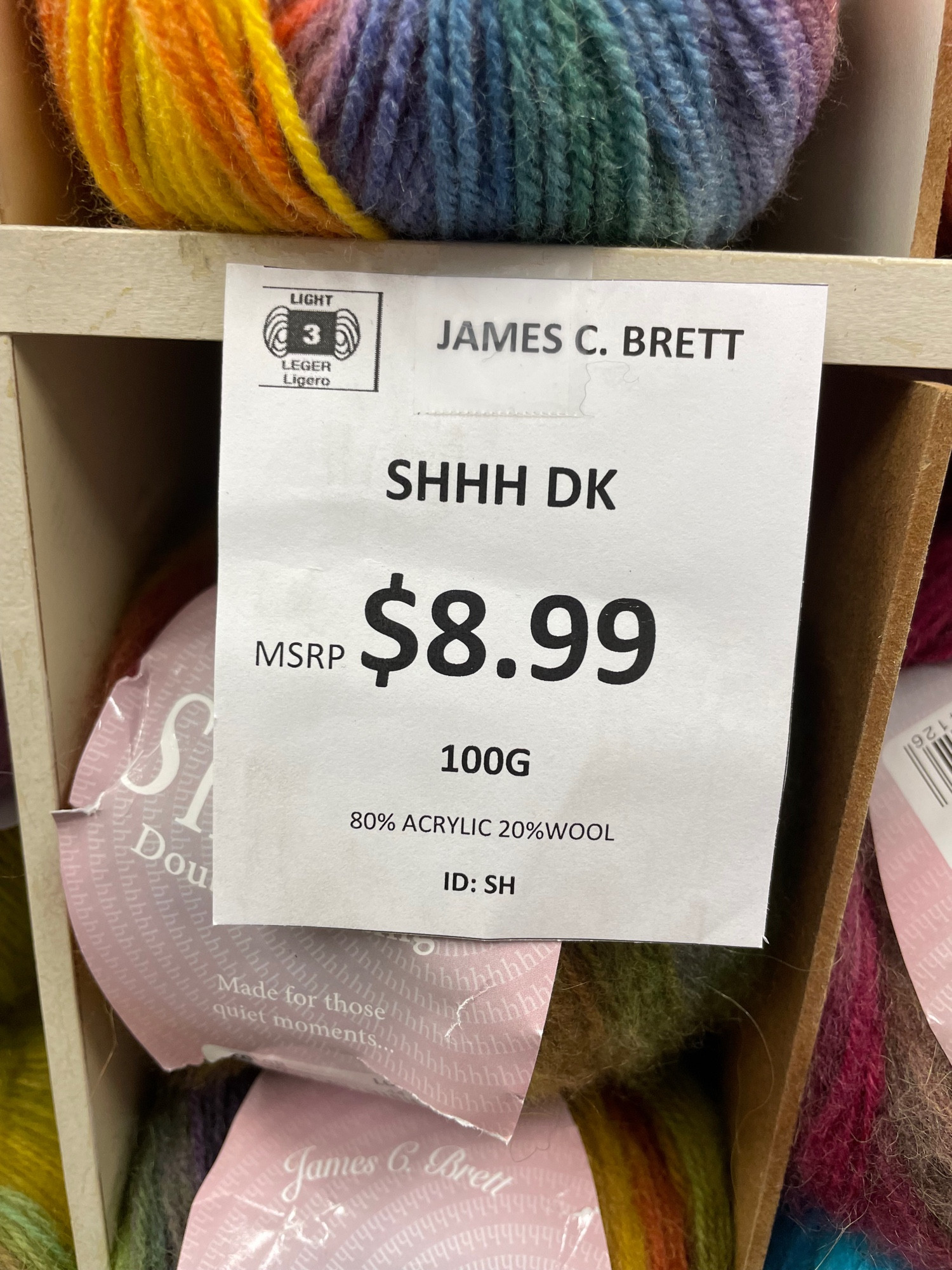 price tag at the yarn store that says “shhh dk”