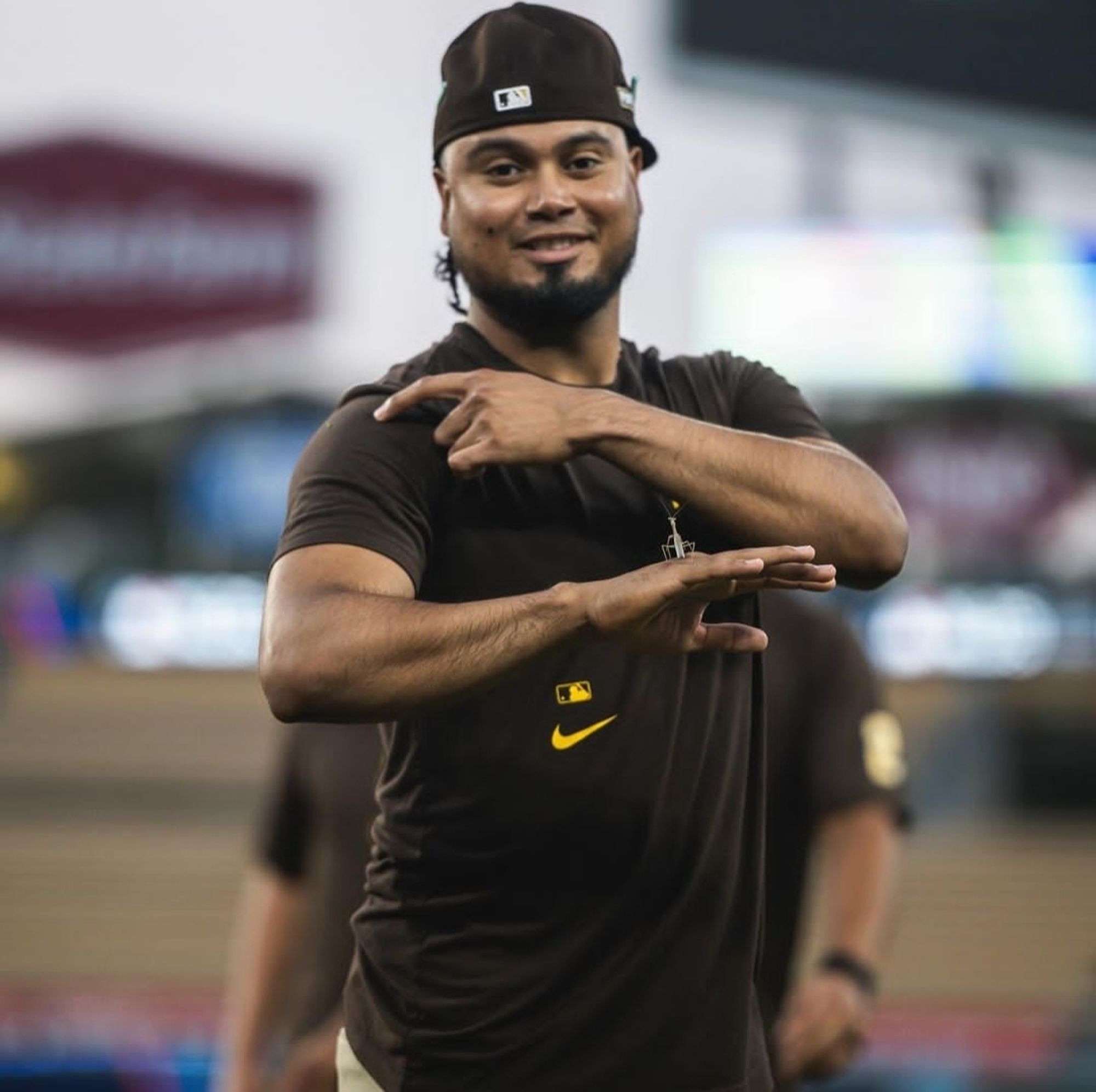 Padres 1st baseman Luis Areáez proudly showing off the praying mantis he found