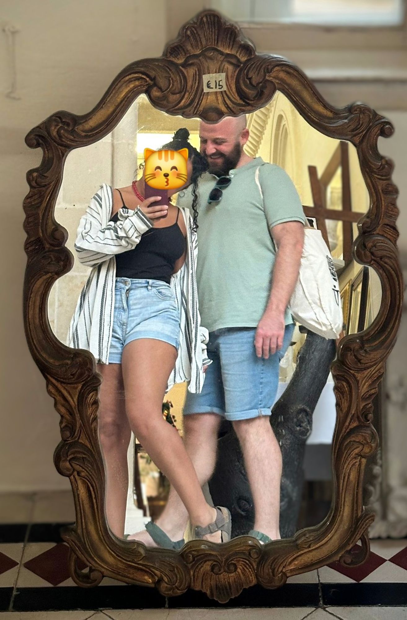 me and bae posing in front of a €15 mirror in a church vestibule. right after this a nun walked by and told us our legs look great, in Maltese.