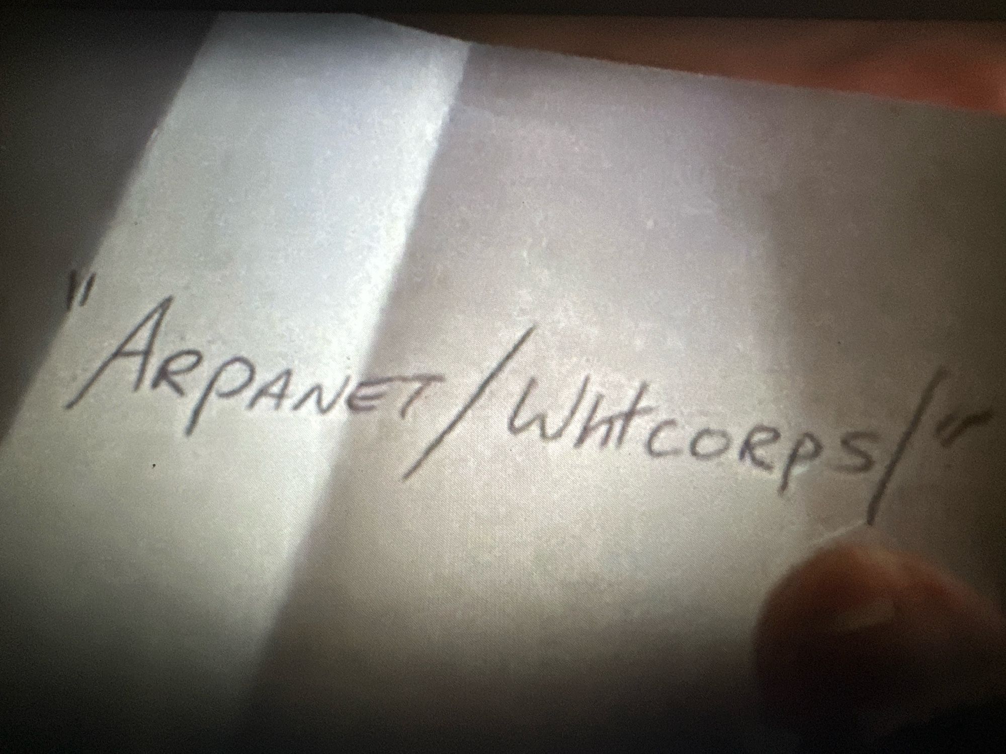 white slip of paper reading: “ARPANET/WHTCORPS”