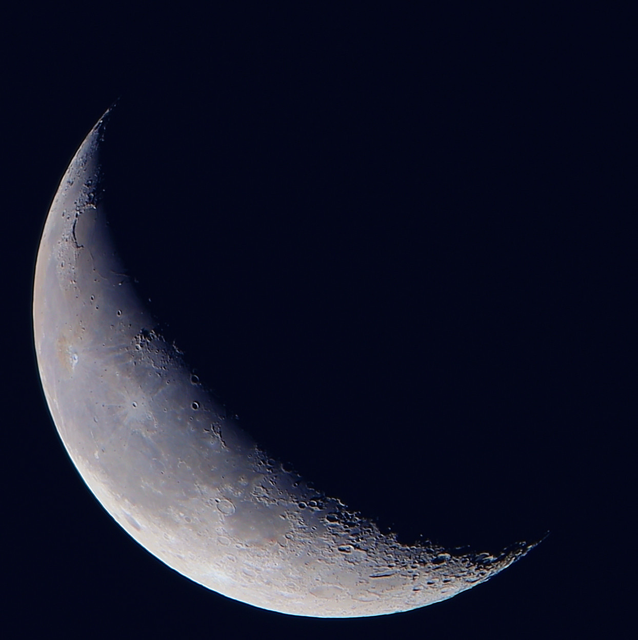 Quarter Moon waning 2024-09-27 against dark sky