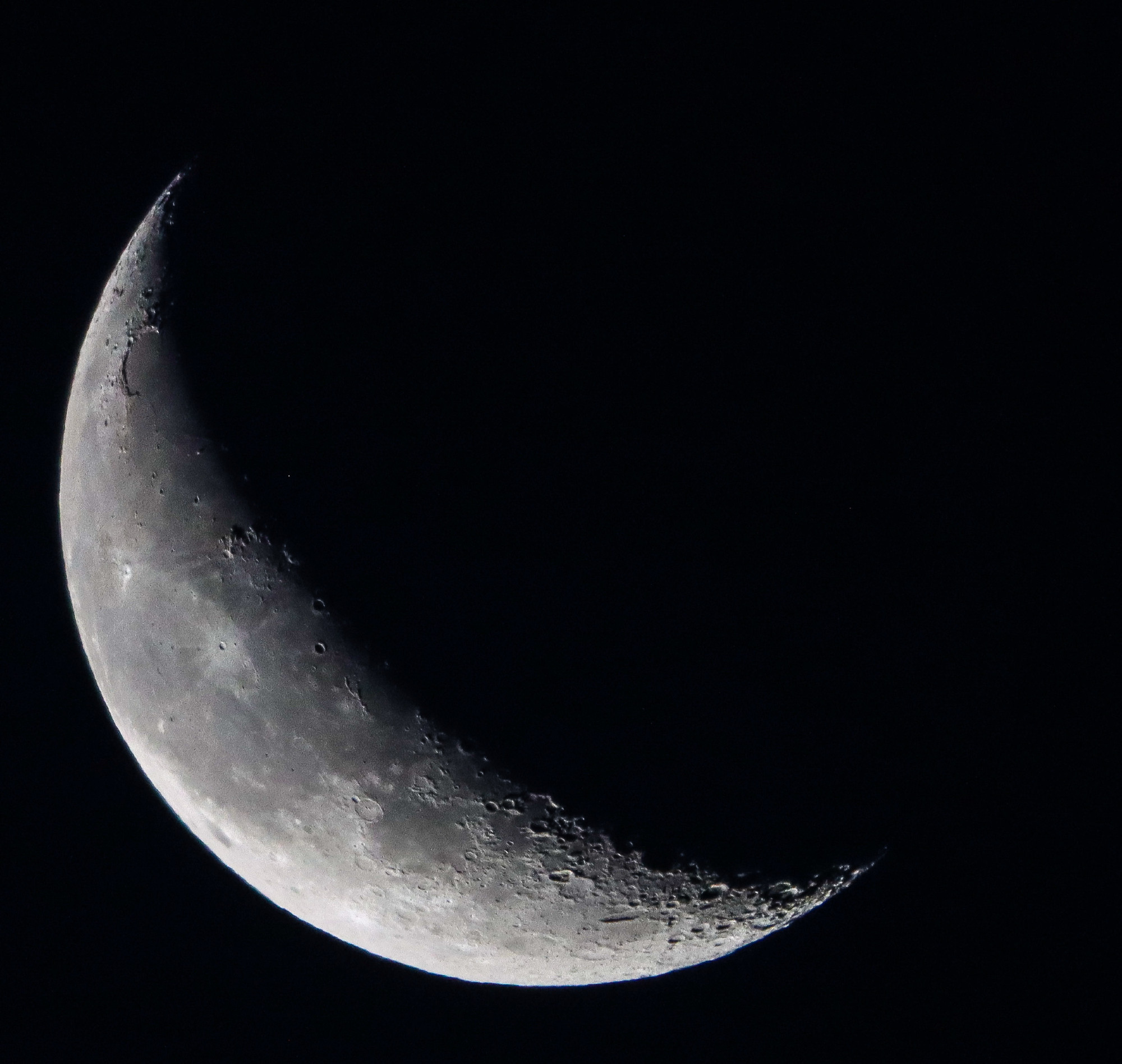 Quarter Moon waning 2024-09-27 against dark sky