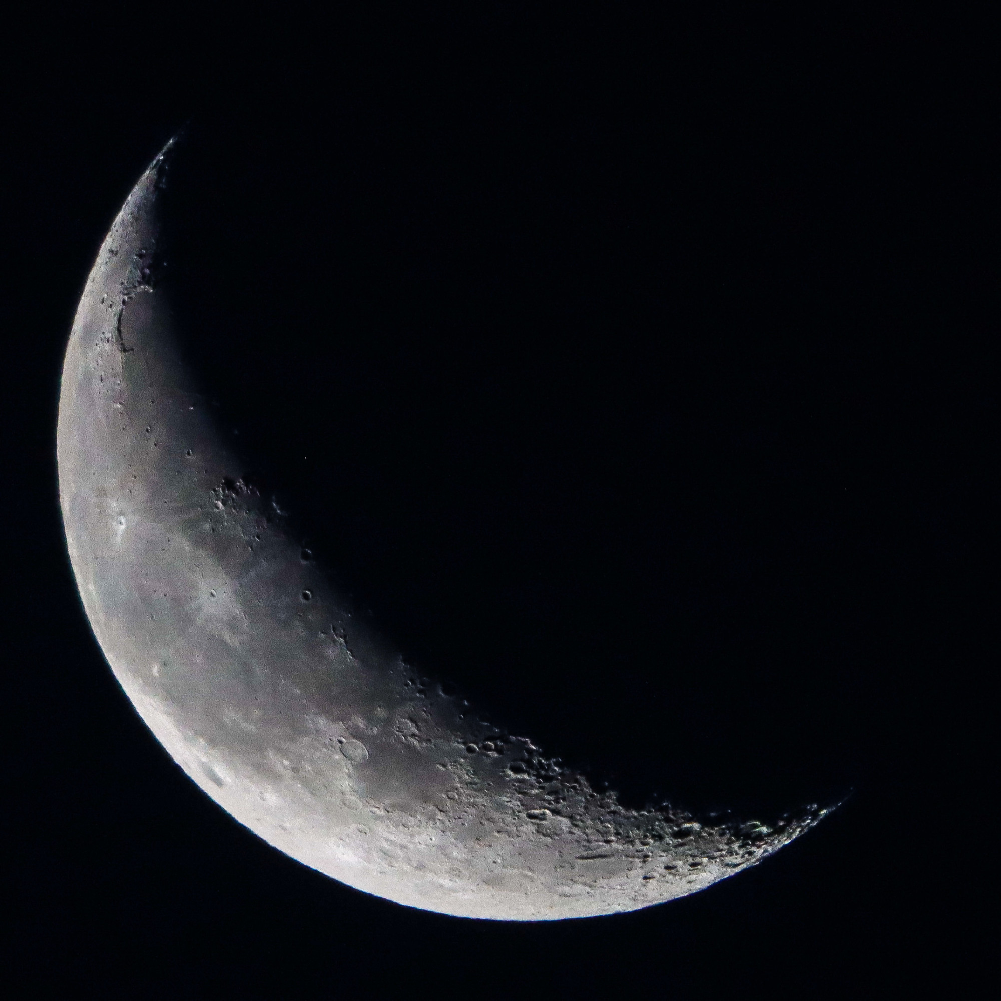 Quarter Moon waning 2024-09-27 against dark sky