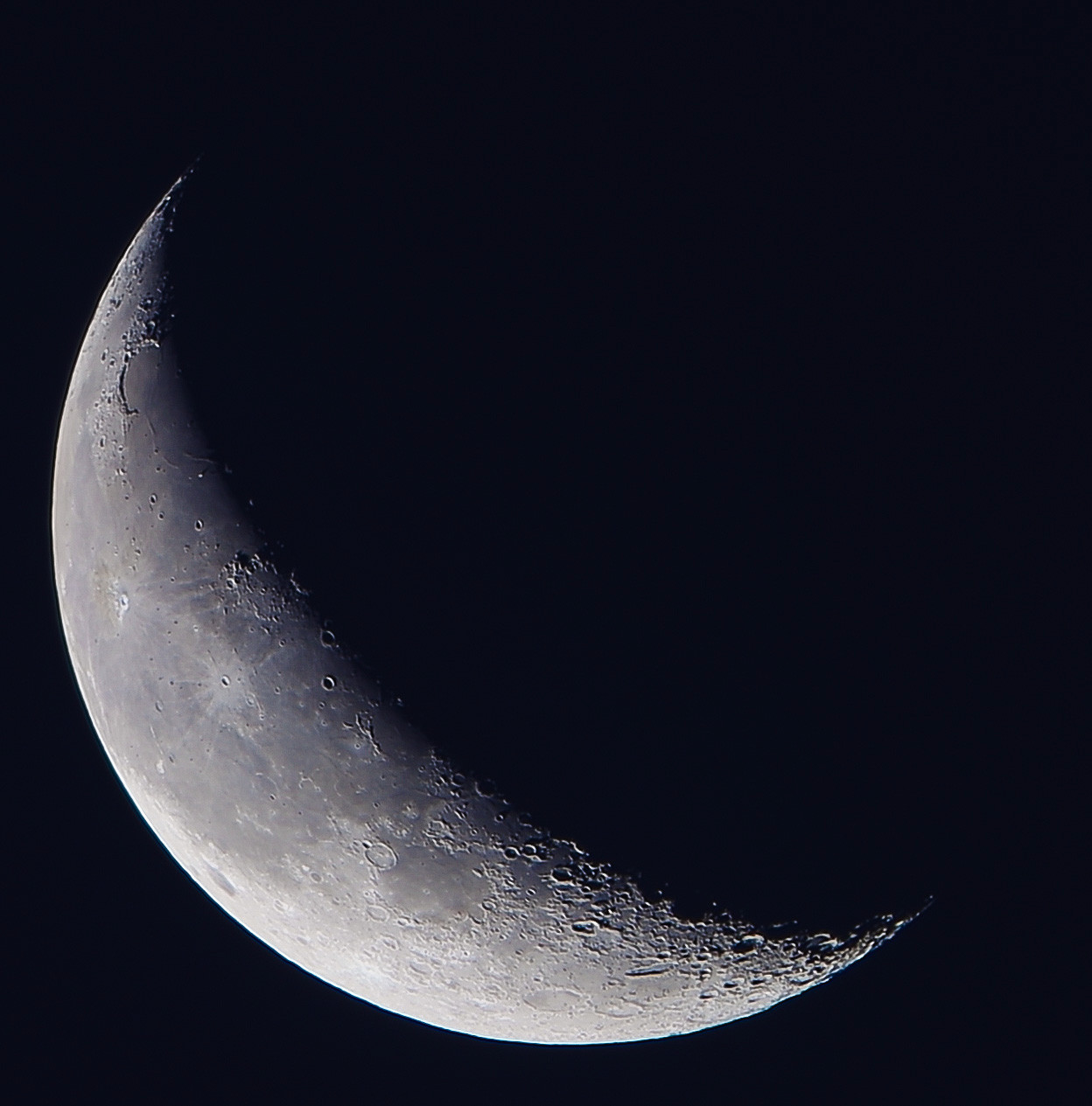 Quarter Moon waning 2024-09-27 against dark sky