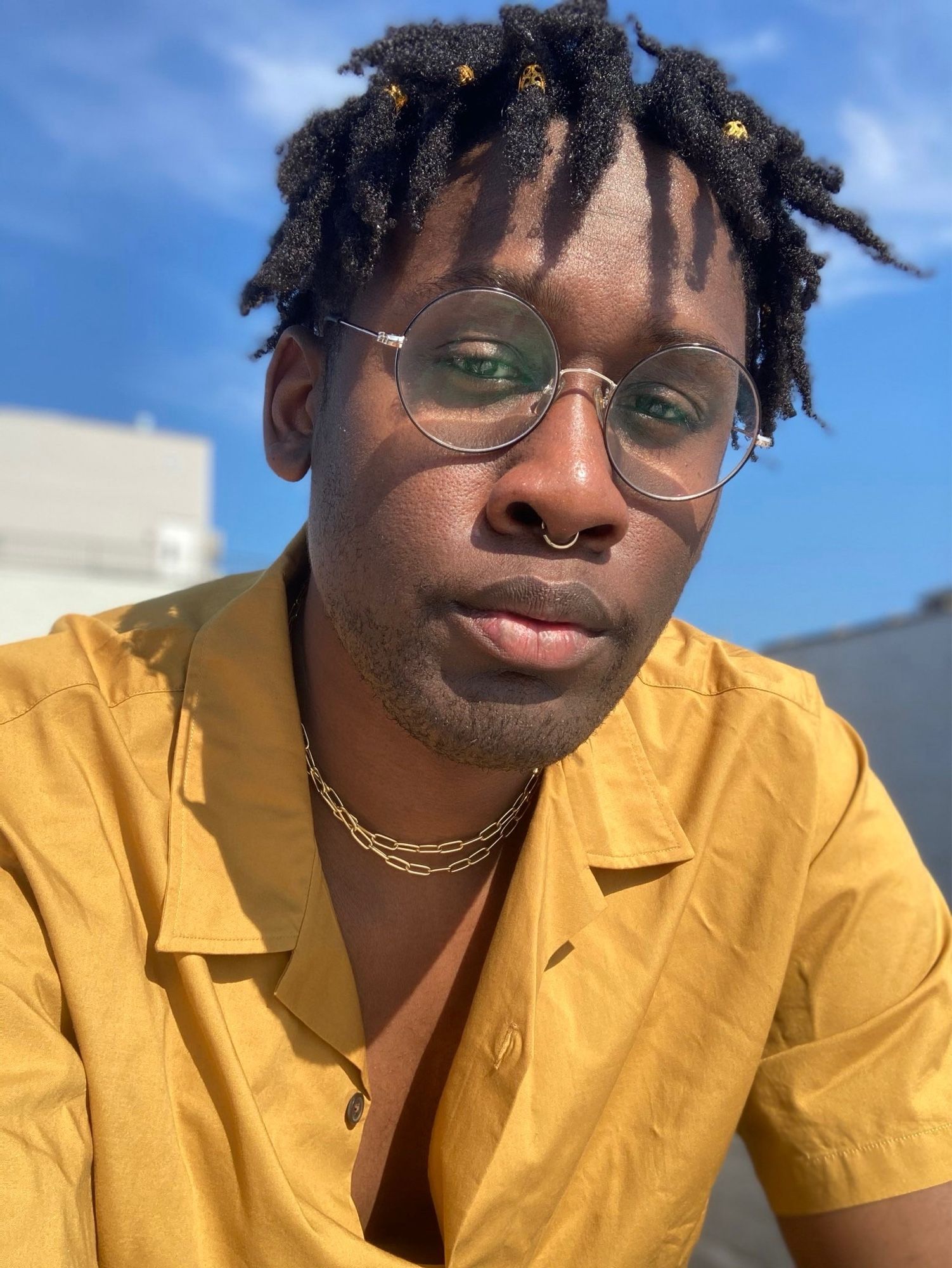 Pic of me from 2020, with starter locs—they’re maybe five months old? I couldn’t get a retwist due to The Unprecedented Times