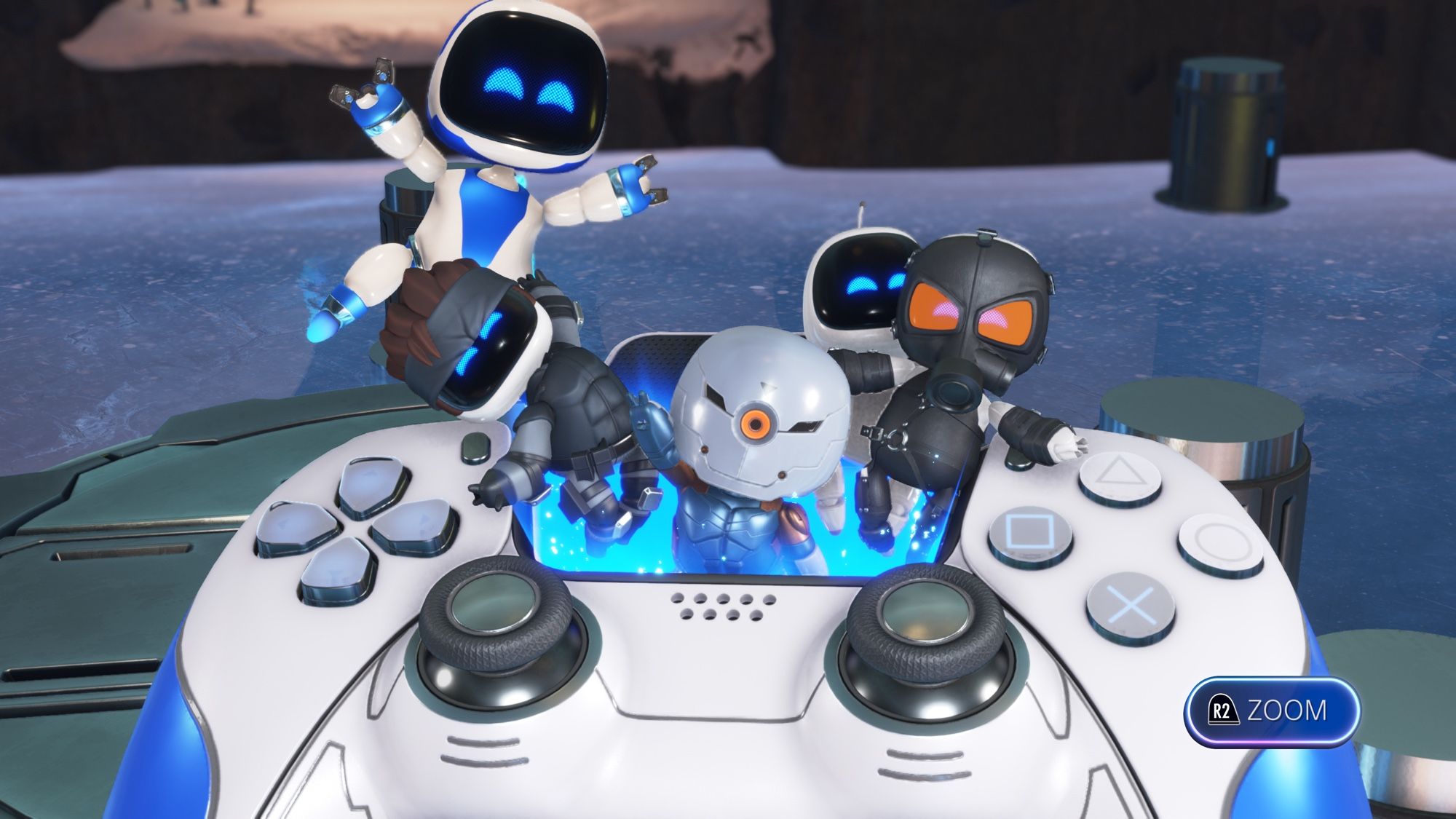 A screenshot of Astro Bot. In the screenshot there are bots dressed up as Solid Snake, Gray Fox and Psycho Mantis from Metal Gear Solid (1998). They are relaxing in a small hot tub located under the touch pad of a PS5 Dualsense Controller.