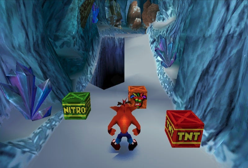 In-game screen capture from Crash Bandicoot 2. Crash is faced with a choice of 3 boxes. A power up mask, a nitro box, and a TNT box. Surely this is easy, but he *is* a rabid anthropomorphic bandicoot, so who knows where he'll go.