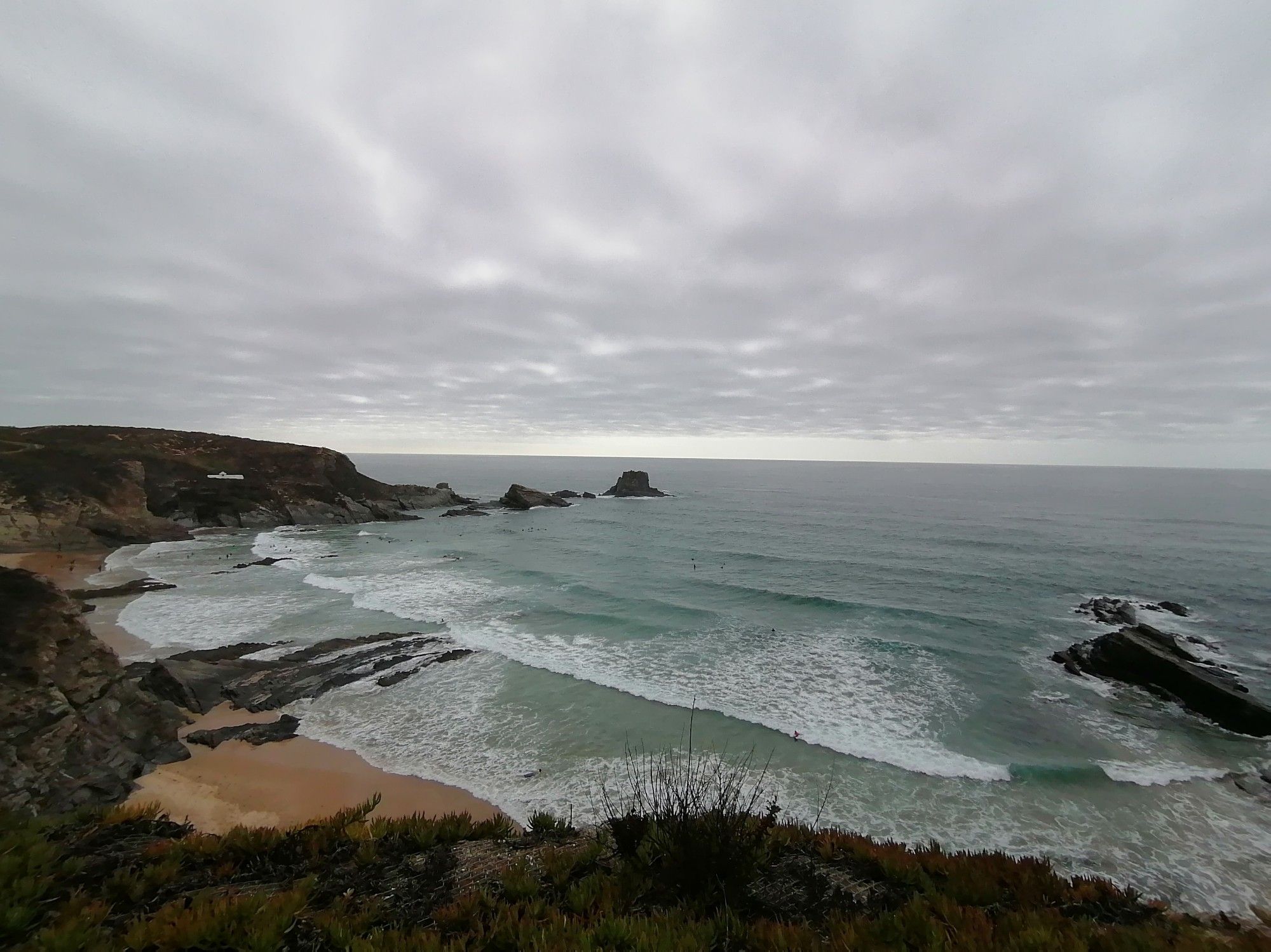 Zambujeira do Mar beach, on the rocky coast of Southern Alentejo, Portugal. Still lovely even under overcast weather.