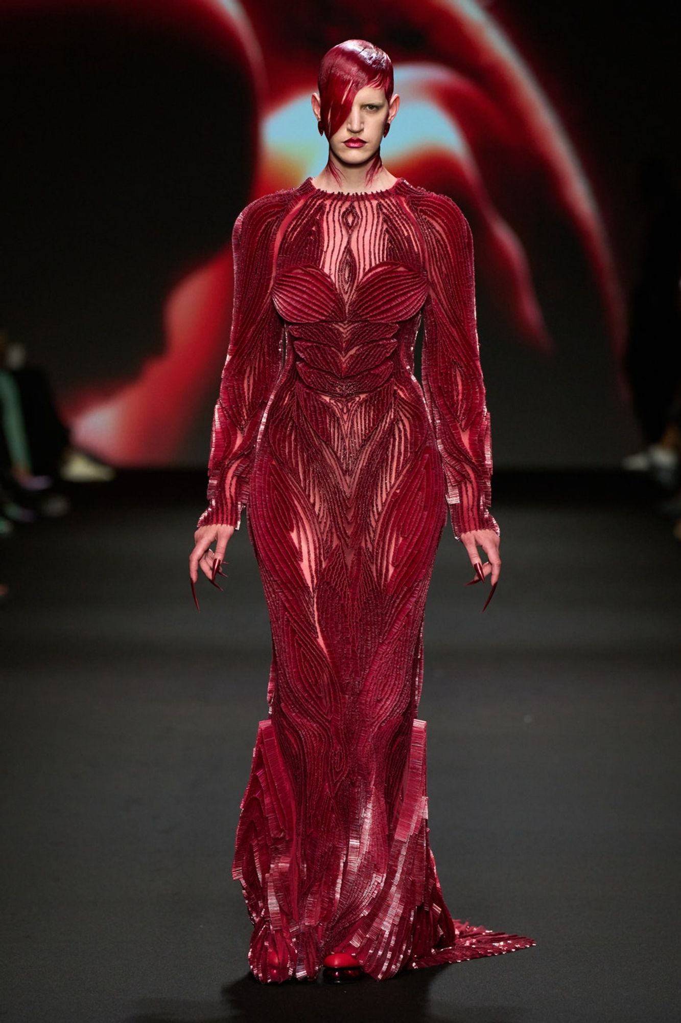 a red dress that is slightly textured. it resembles flesh