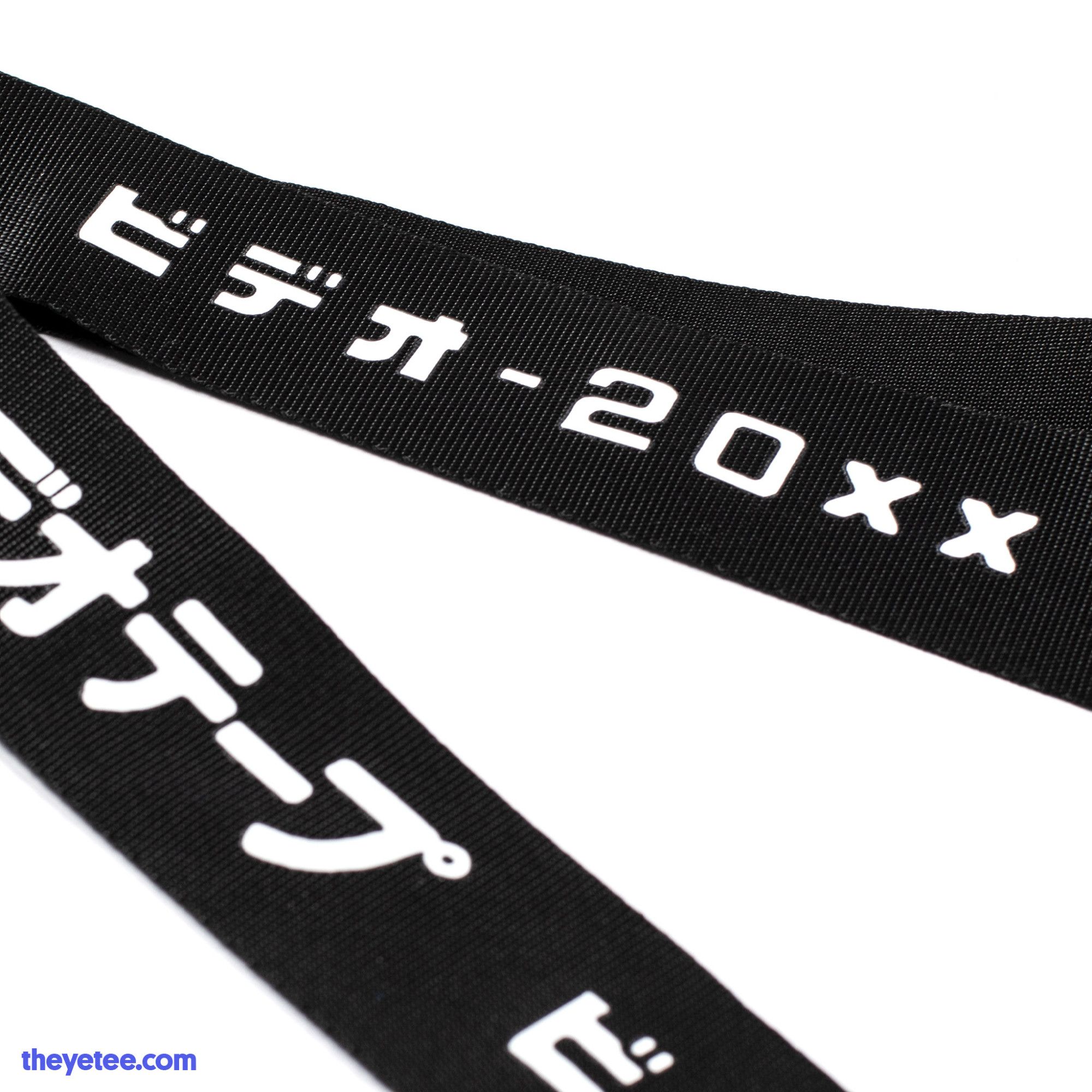 A close up of the field bag strap. White text on black strap.