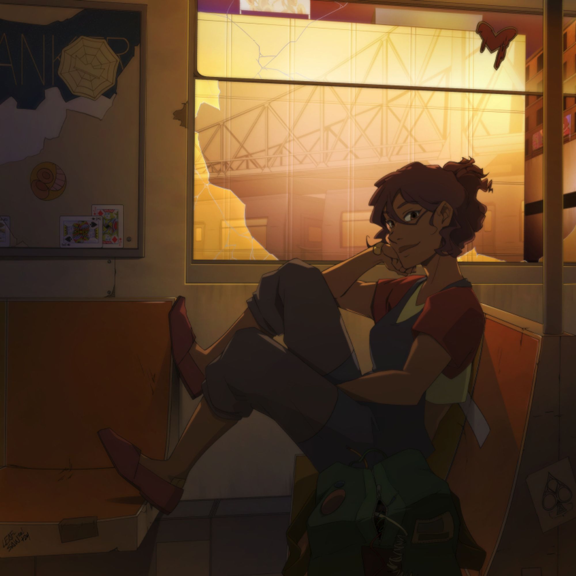 June sits in a broken subway car with a soft smile as she leans against a window.