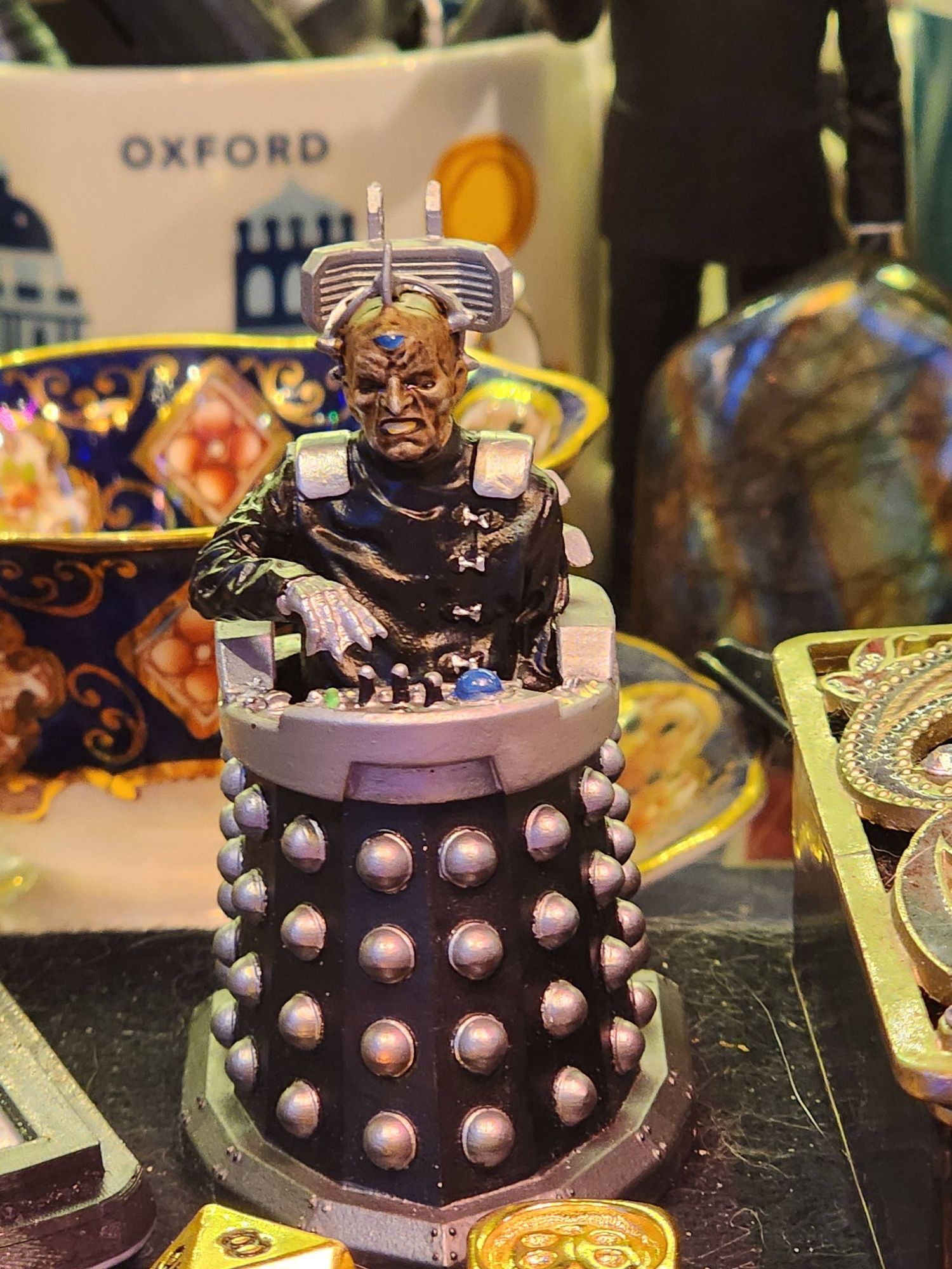 A picture of a toy Davros on a desk.