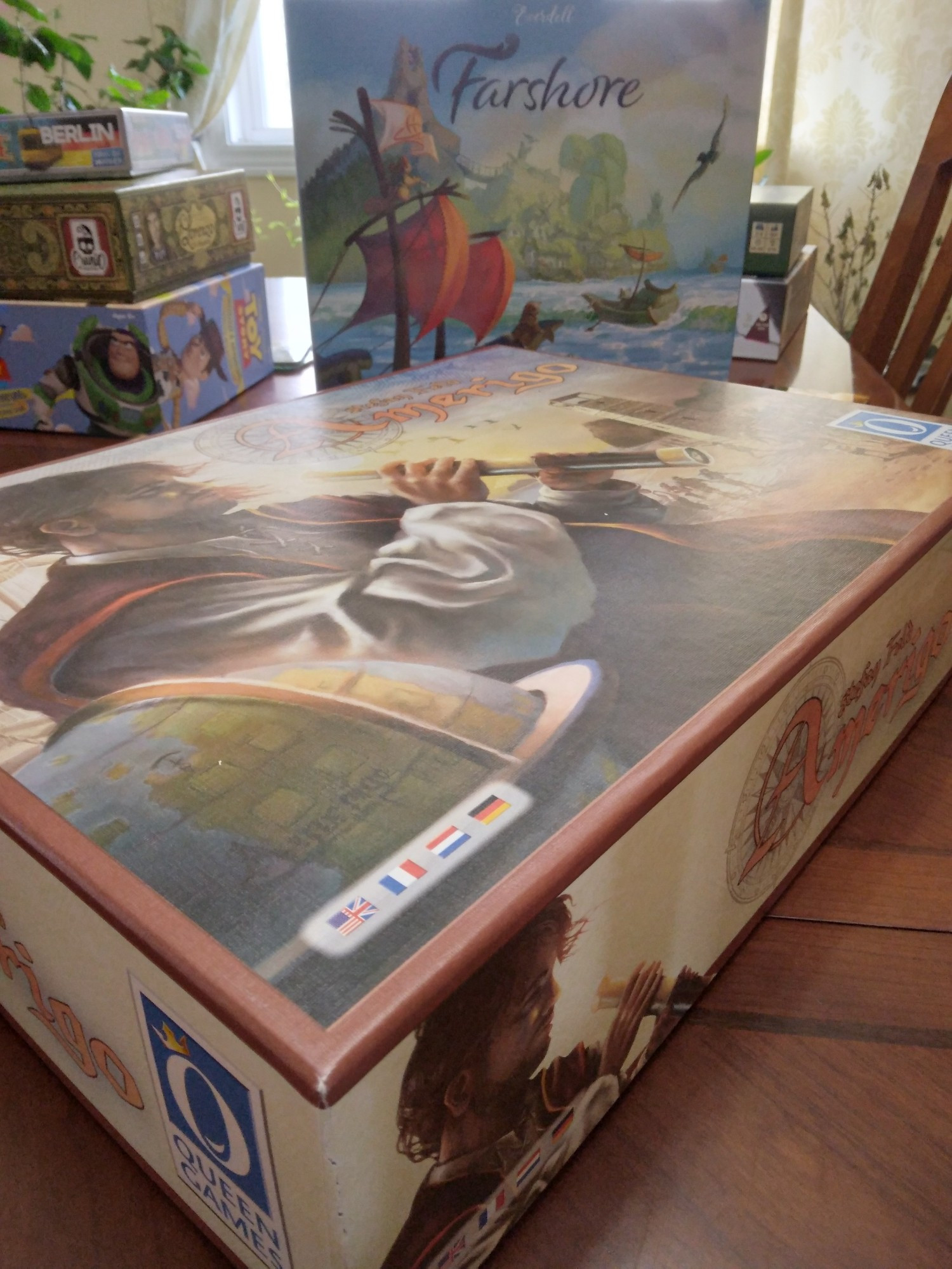 Boxes of board games including Amerigo, Farshore, Lorenzo, TtR Berlin, Toy Story Obstacles.