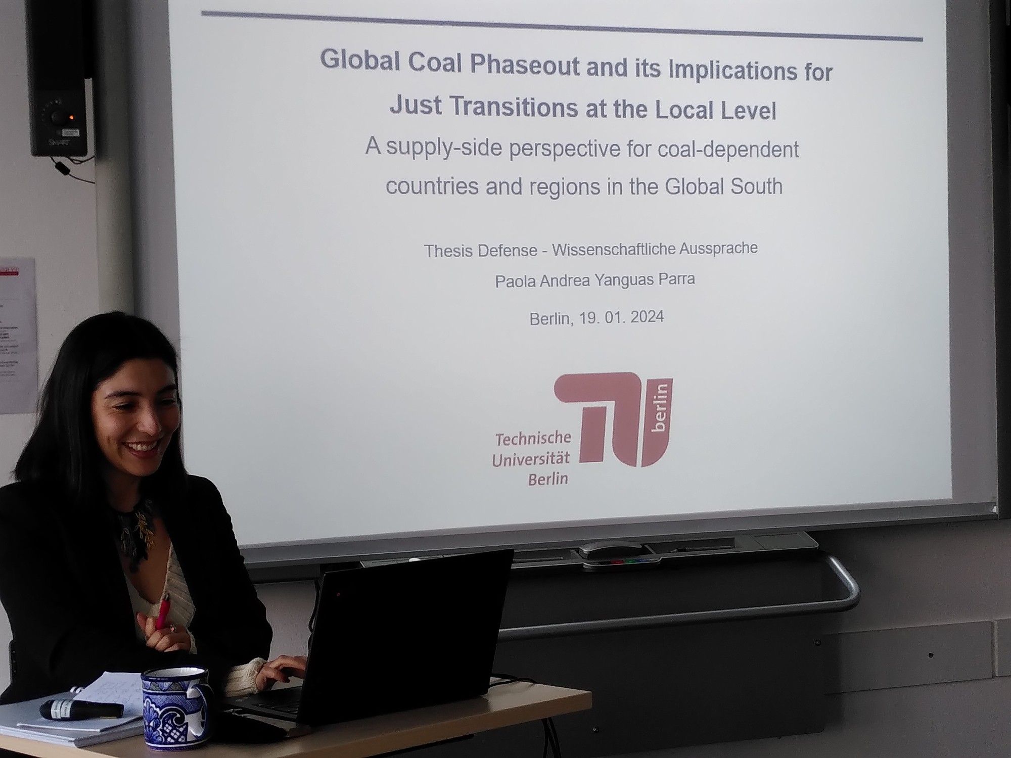 Paola defending her thesis on coal markets