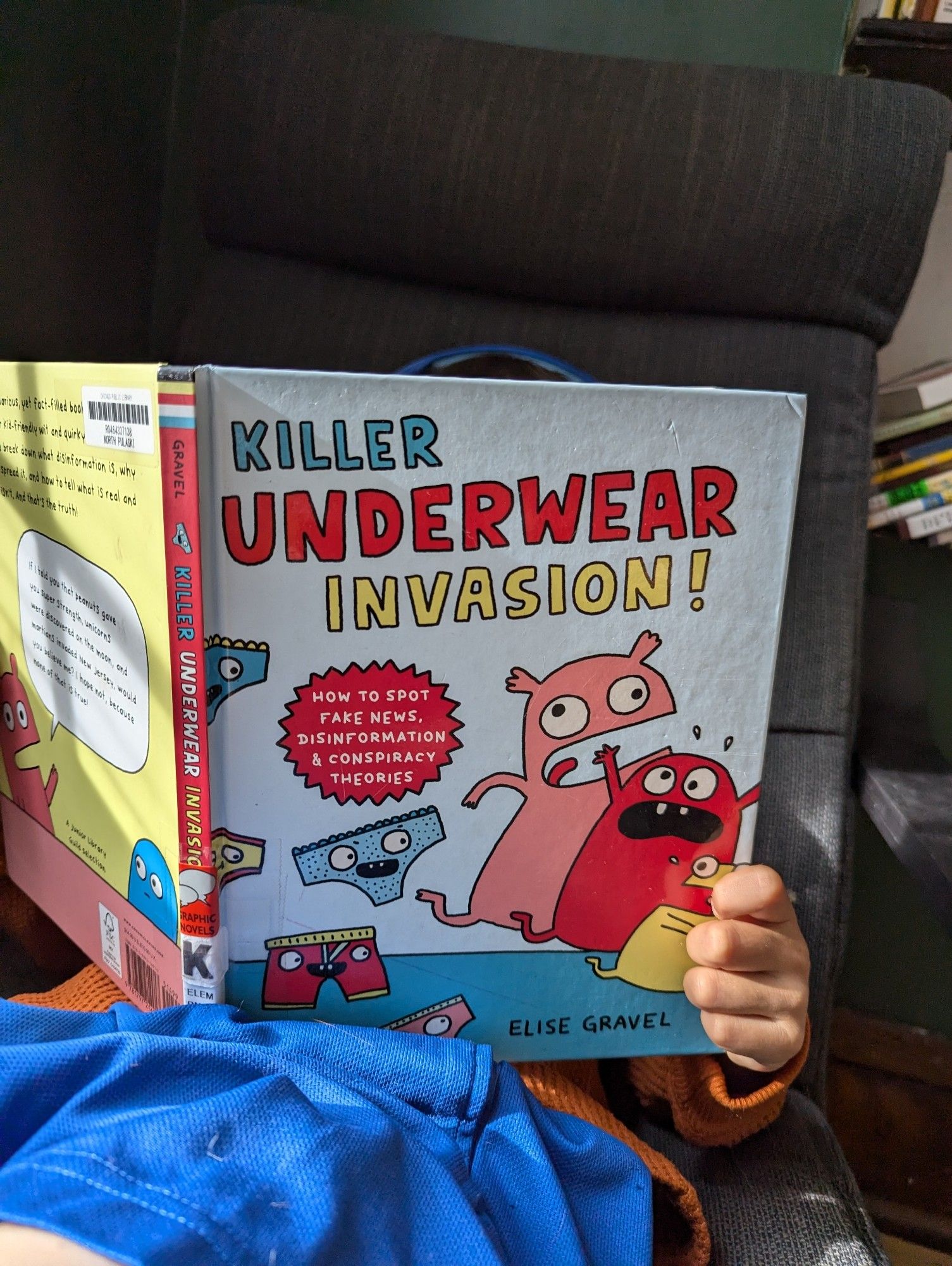 Six year old reading killer underwear invasion! The cover has a bunch of graphic monsters running away from underwear with faces. Full title and author info in post.