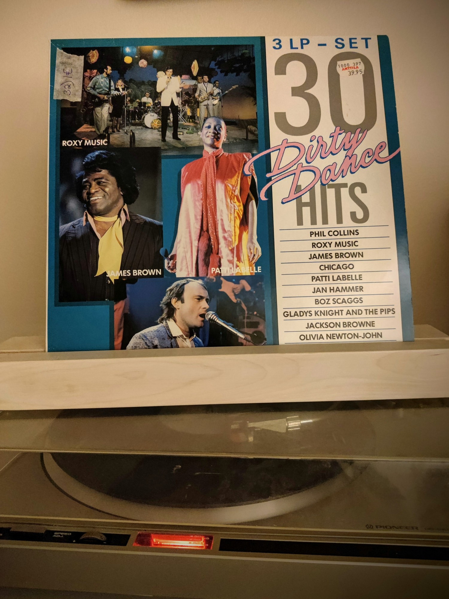 Vinyl album "30 Dirty Dance Hits" 3LP set on record player.