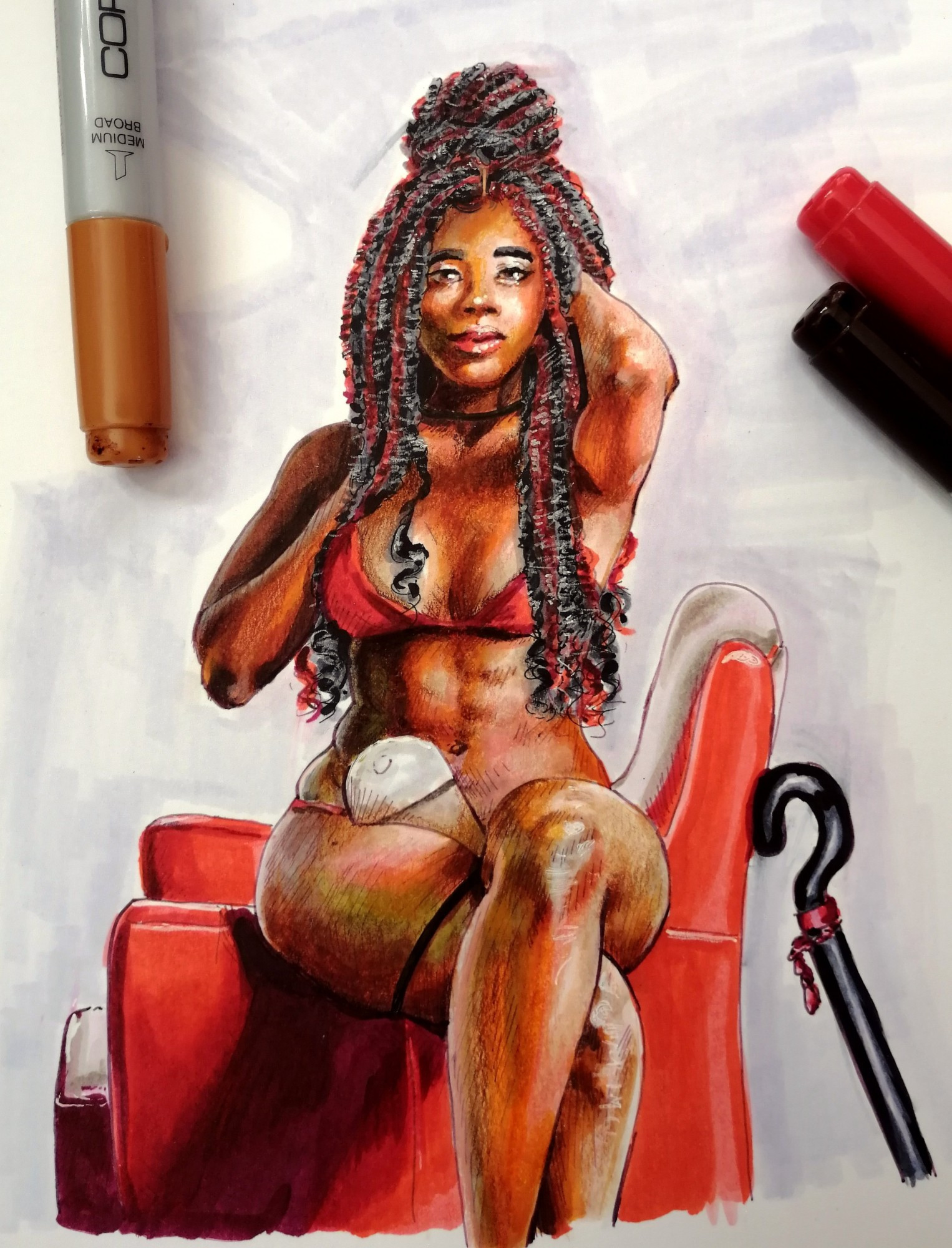 Omorfia is a slim Black woman with light abs and thick thighs. She sits on the arm of a red armchair with one leg over the other, a black cane resting against the chair. She wears red lingerie and holds one hand up into her long, black and red braids that are partially down, partially in a high bun. She has a stoma bag.