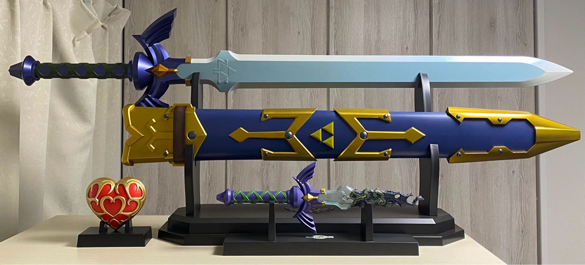 Proplica The Legend of Zelda Master Sword and sheath, Ichiban Kuji Tears of the Kingdom Master Sword, and Takarajima Heart Container Interior Light Book