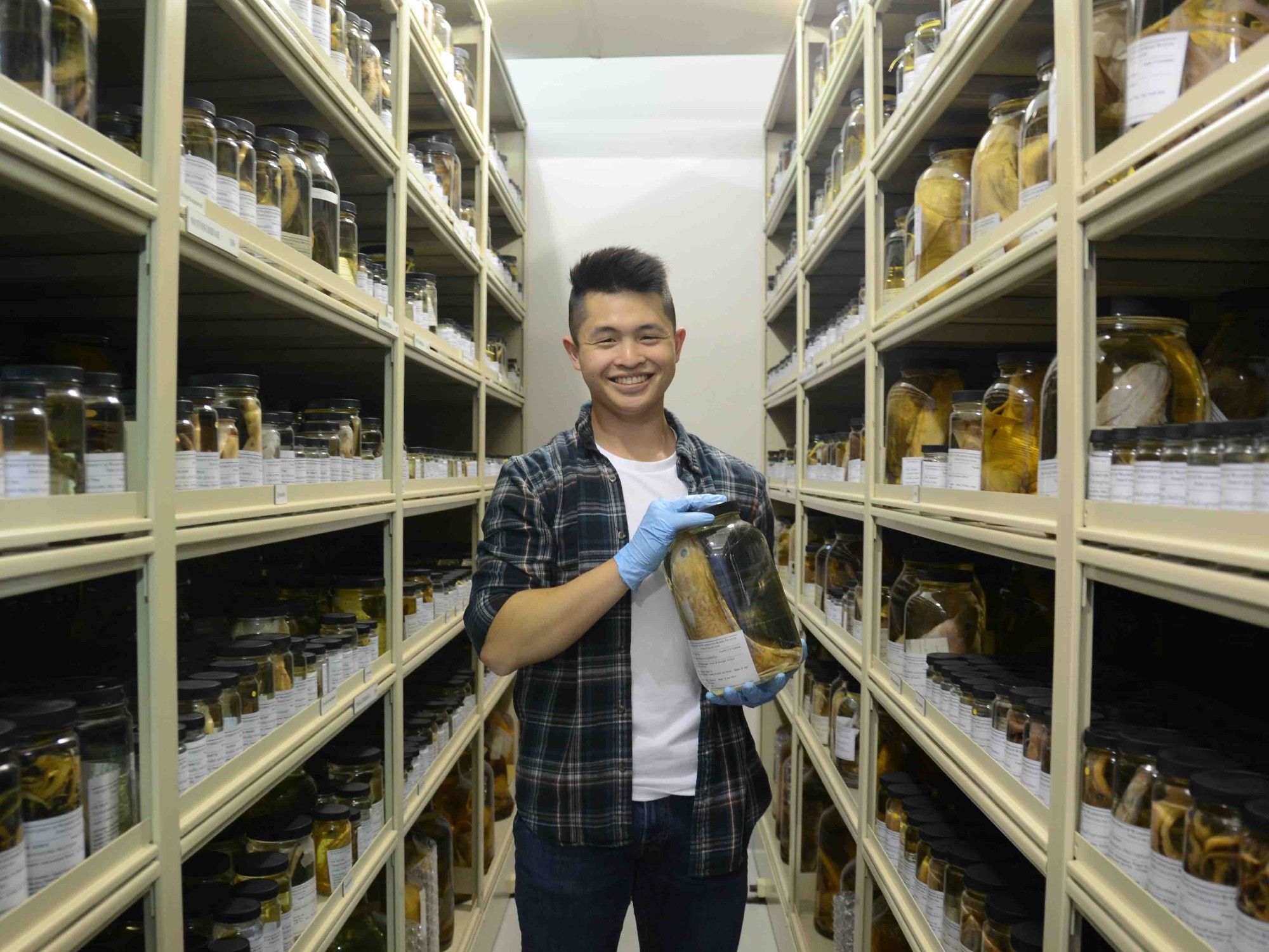 me holding a jar of fishes in the collection