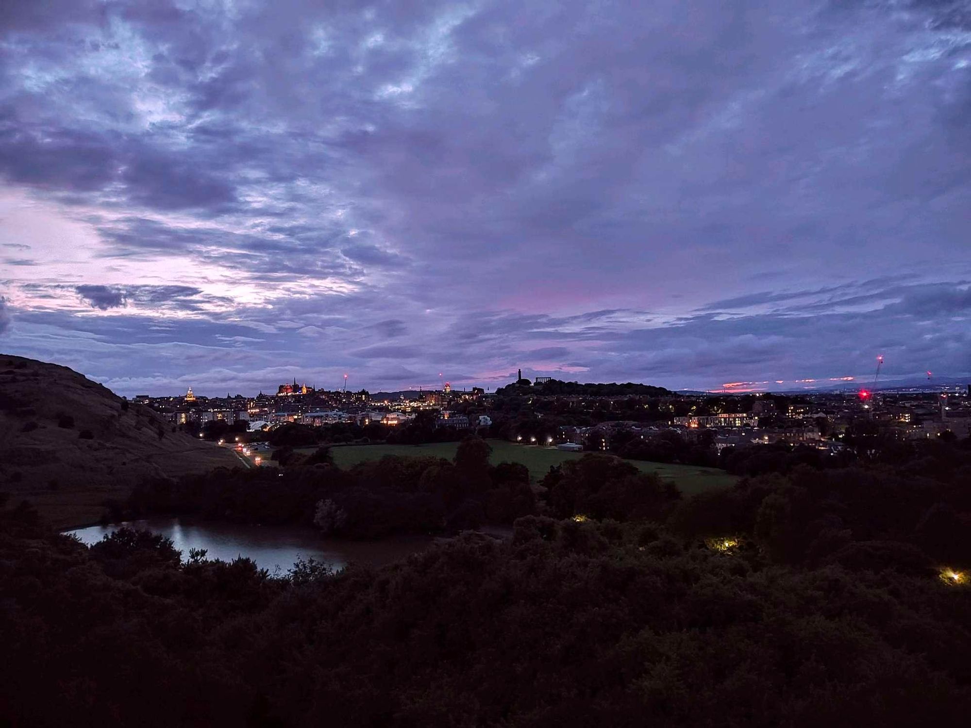 View of Edinburgh. Blue orange sky with skyline.