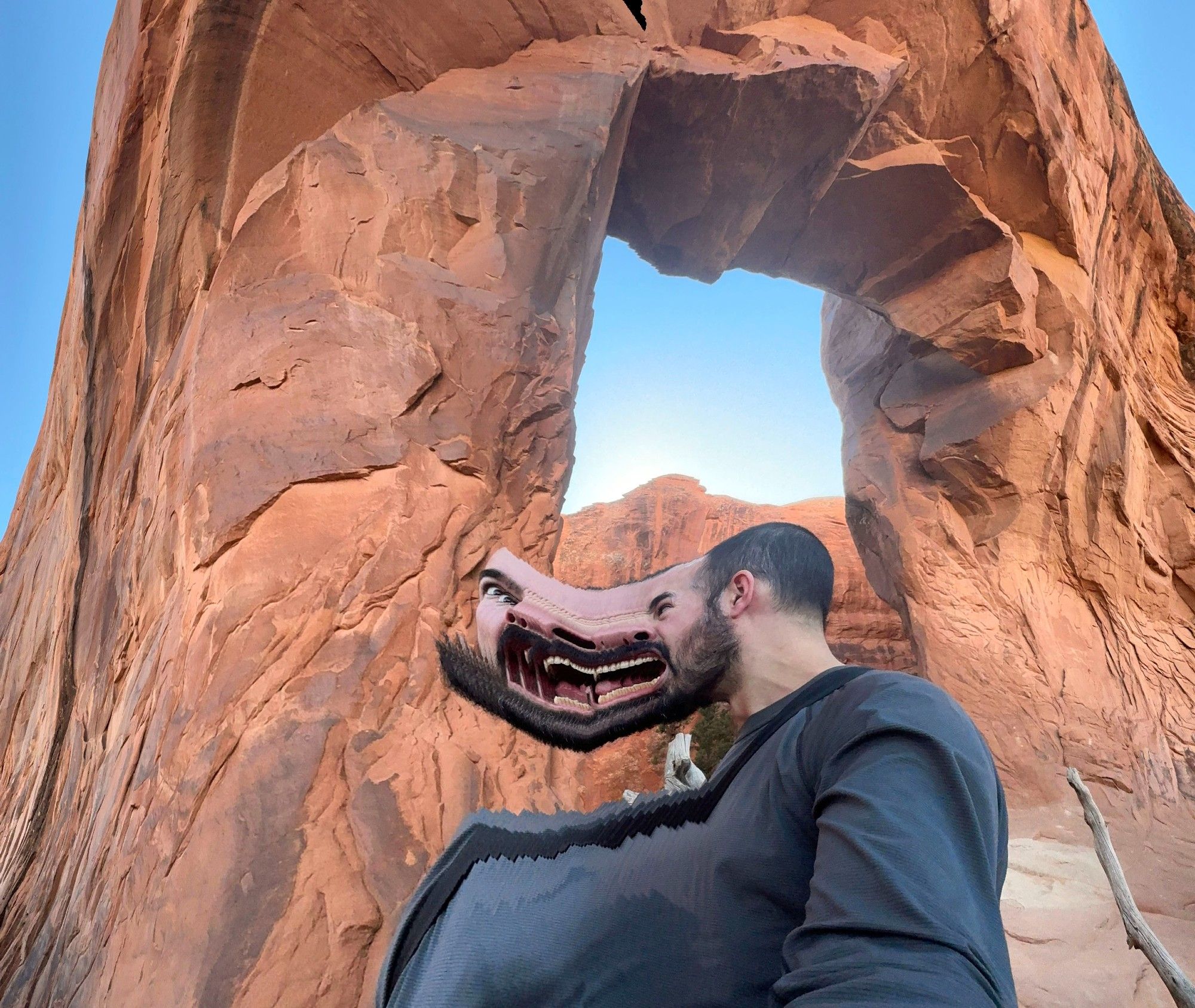 Glitched panorama image at Pine Arch in Arches National Park where my anger manifests in rows of floating teeth.