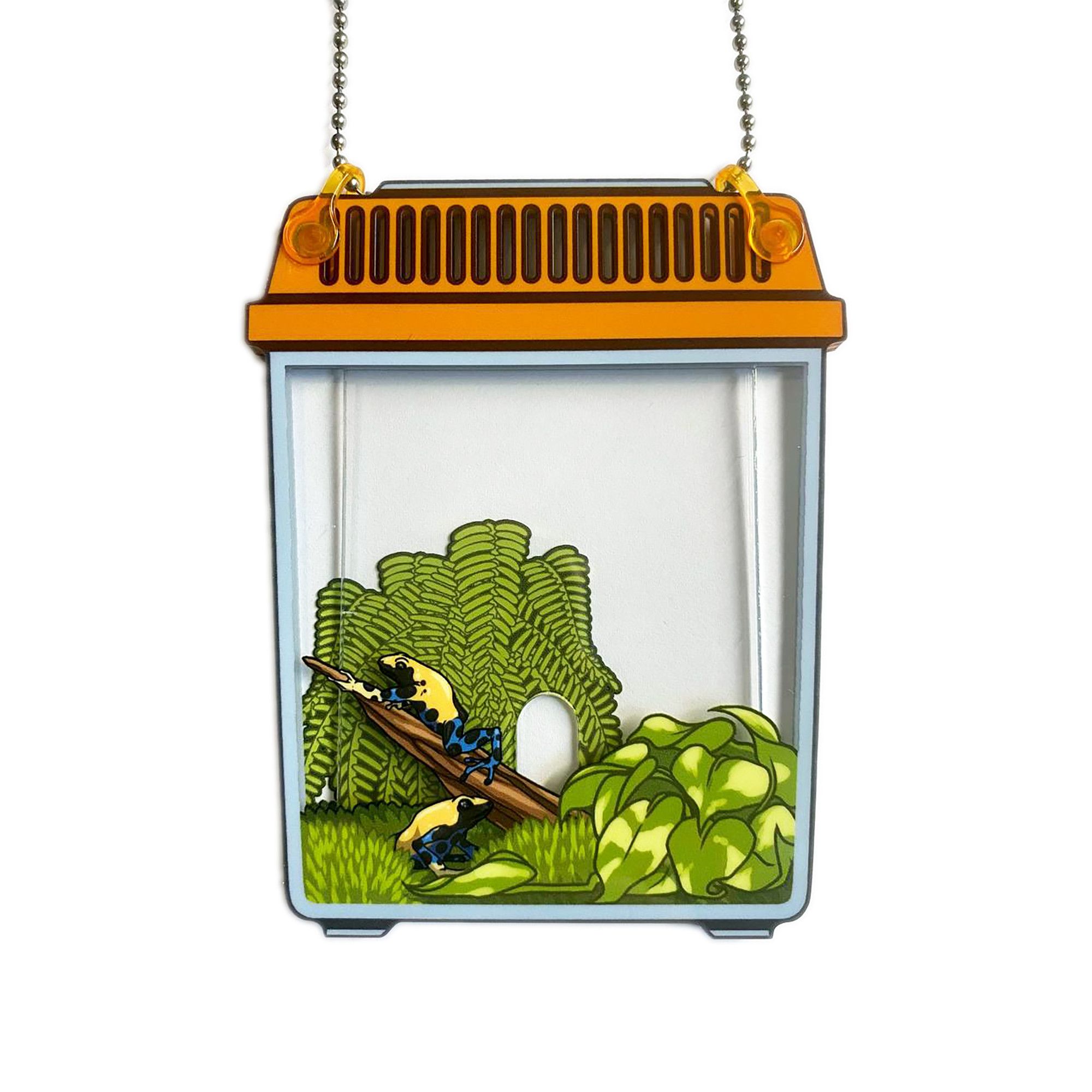 Photo of a key card holder that looks like a orange critter keeper pet cage with two poison dart frogs inside with moss and plants.