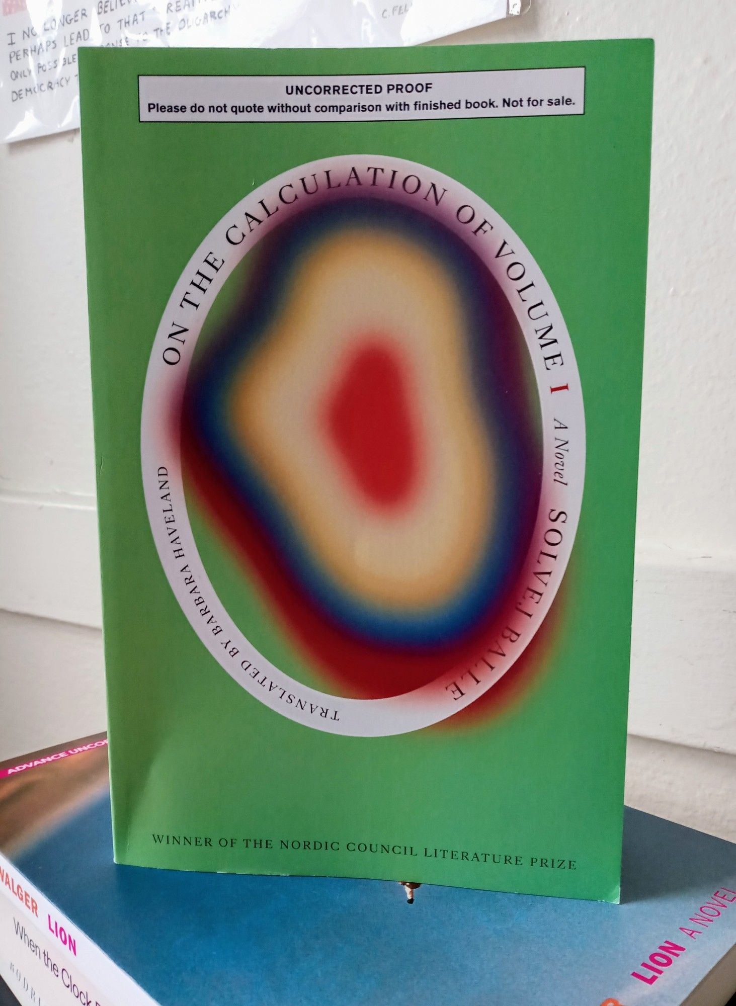 Galley of On the Calculation green with inner colors sitting upright on a stack of galleys.