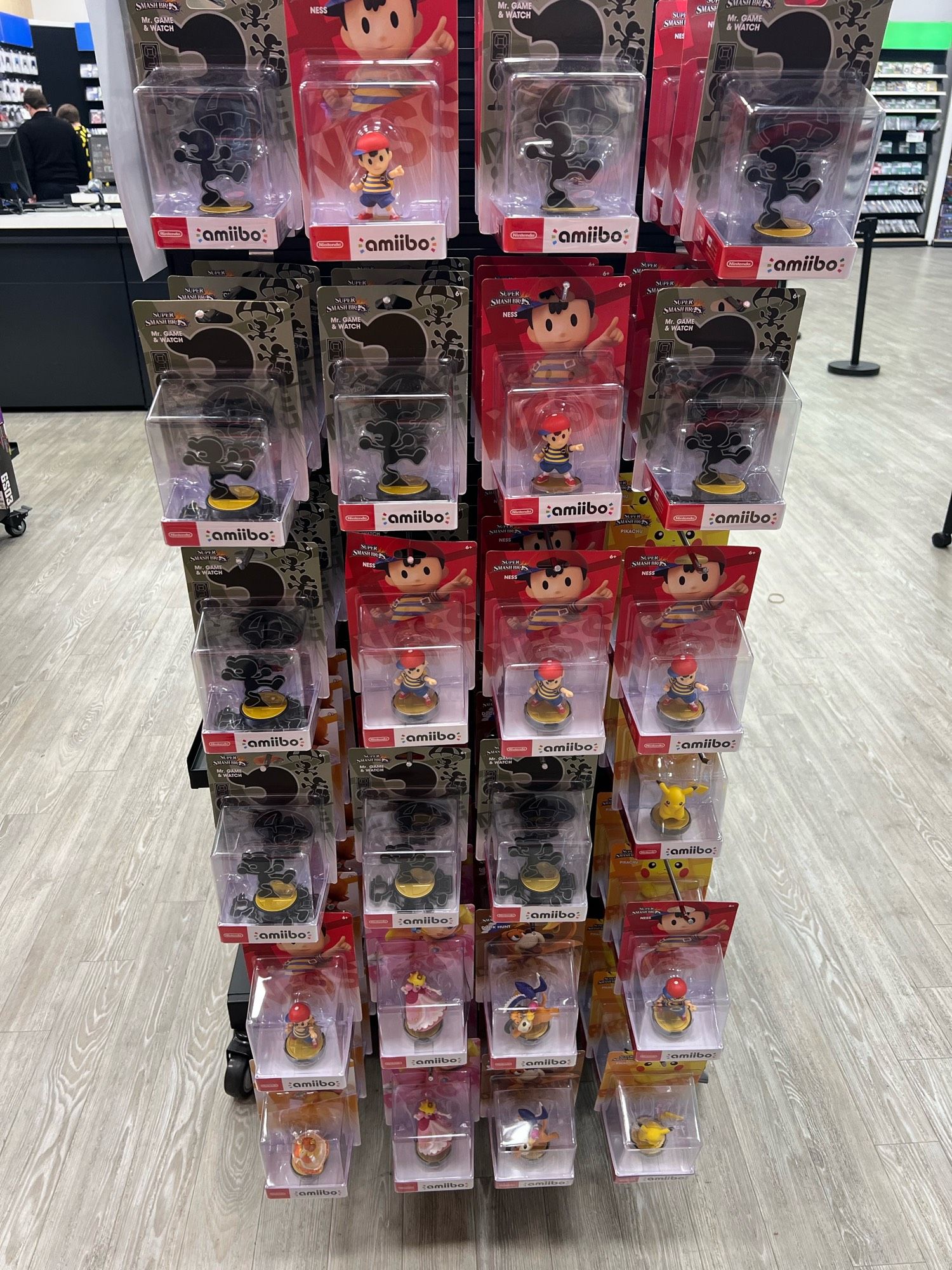 GameStop endcap with a ton of Mr Game & Watch and Ness amiibo.