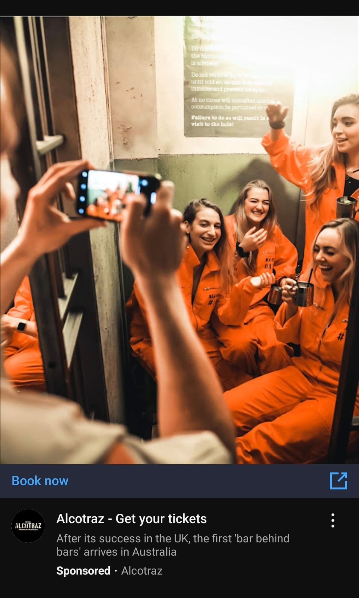 ad for 'alcotraz,' a 'bar behind bars' with what appears to be influencers drinking alcohol in prison uniforms