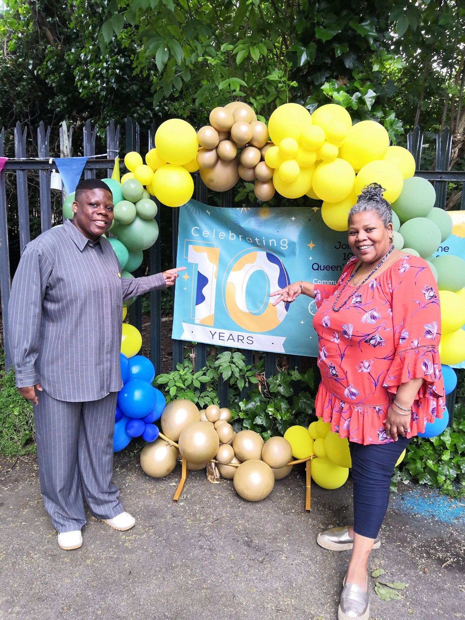 A photo from the Queen’s Park Community Council 10th Anniversary event, featuring Cllr. and Chair of the Council Eartha Pond standing with one of the founding members of the council, and first Chair, Angela Singhate.