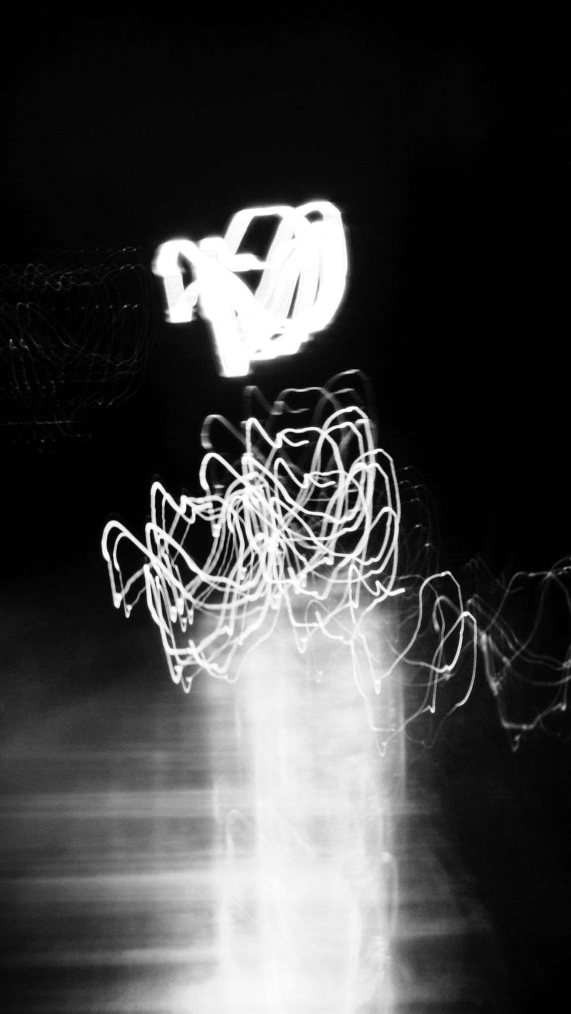 Nighttime. An abstraction of the 606/Bloomingdale Trail. Extreme camera movement and a long shutter speed create blurring and light trails.