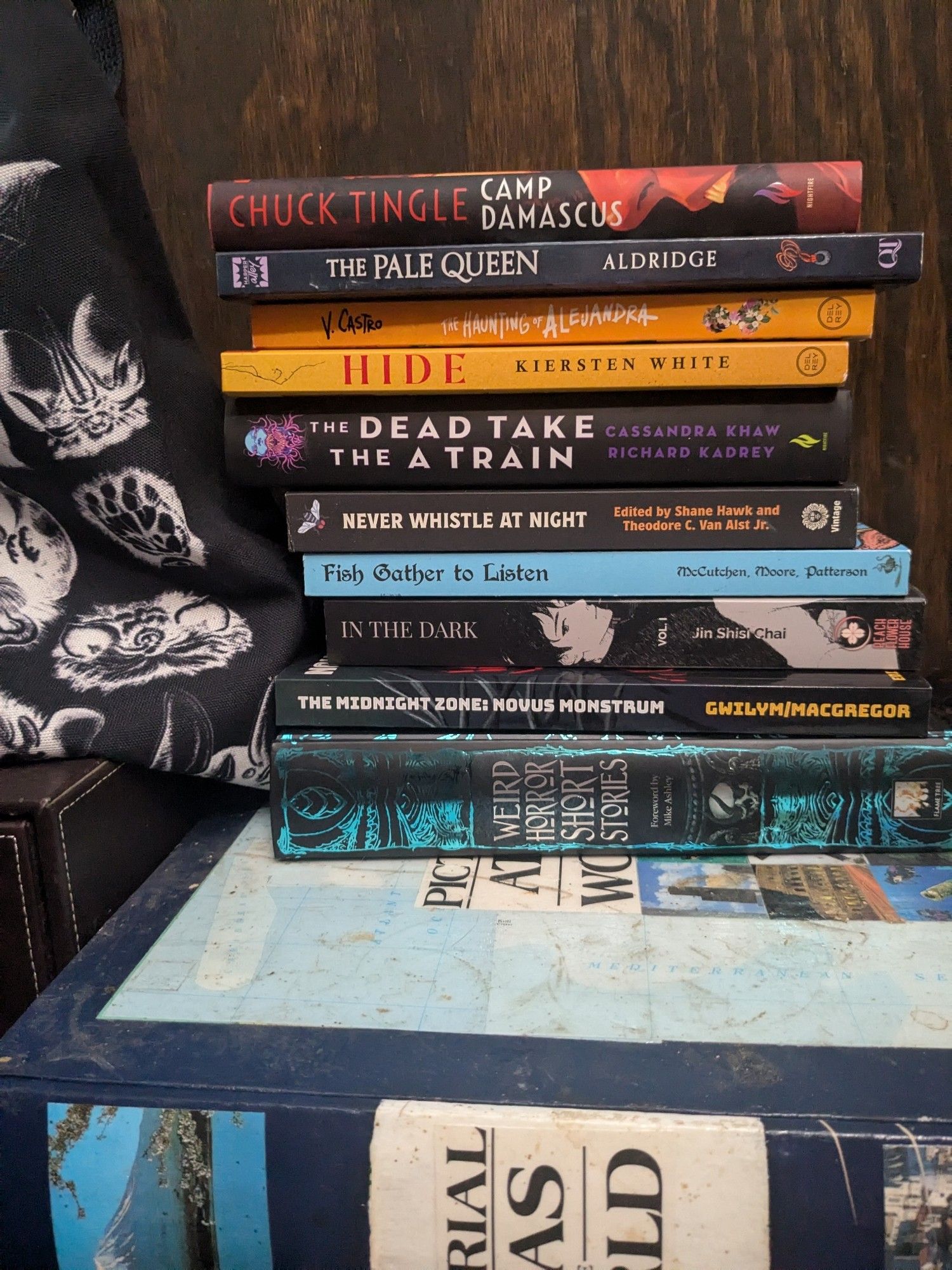 A slightly precarious pile of horror novels and anthologies