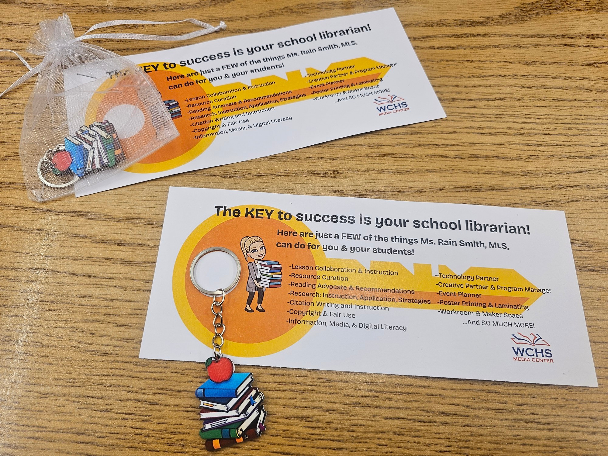Picture of book stake keychain & "the key to success" card.