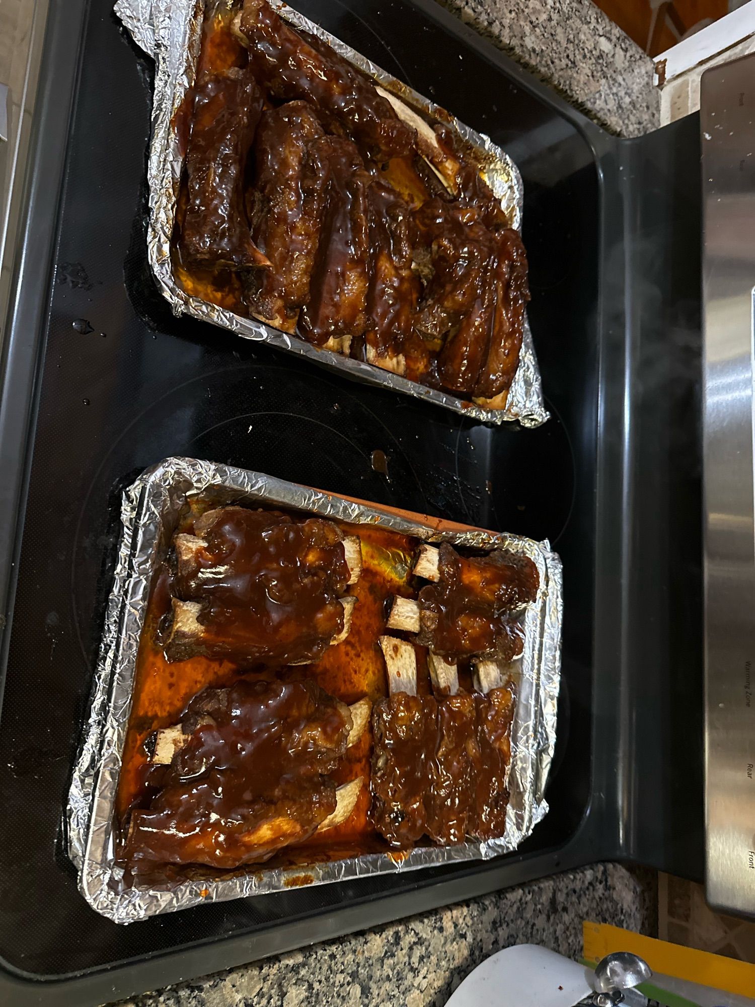 Two trays of homemade beef ribs.