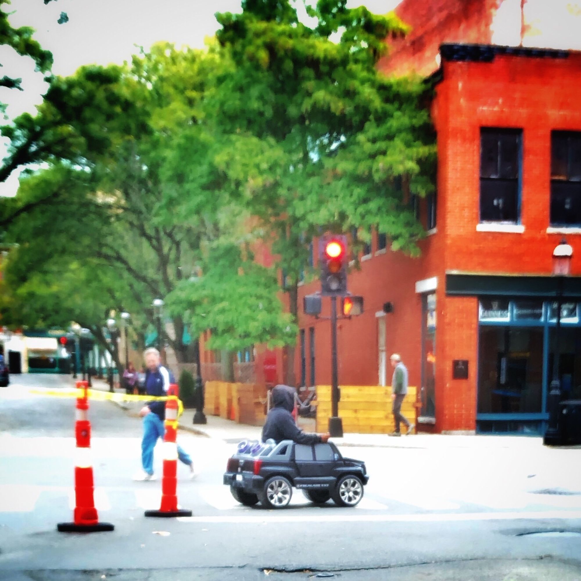 A full grown man driving a child’s toy car in downtown Lowell, Massachusetts, a legend, if we’re being honest