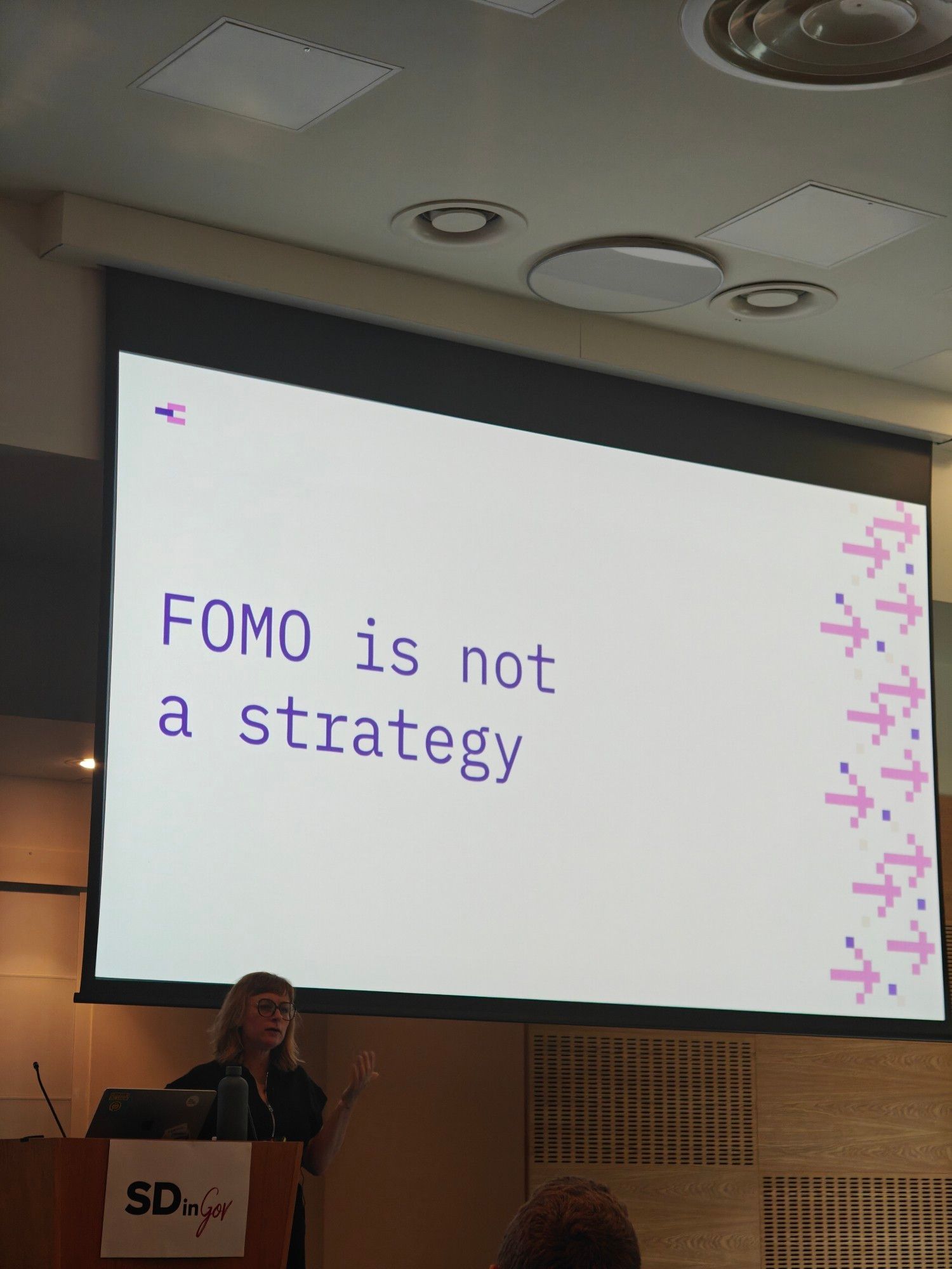 Rachel Coldicutt presenting at SDinGov. The slide reads 'FOMO is not a strategy'