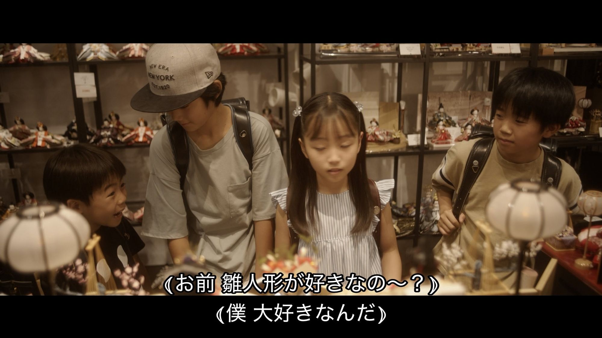 Children looking at dolls while a boy says that he loves Hina dolls.

Boy being disgusted that that boy likes dolls.