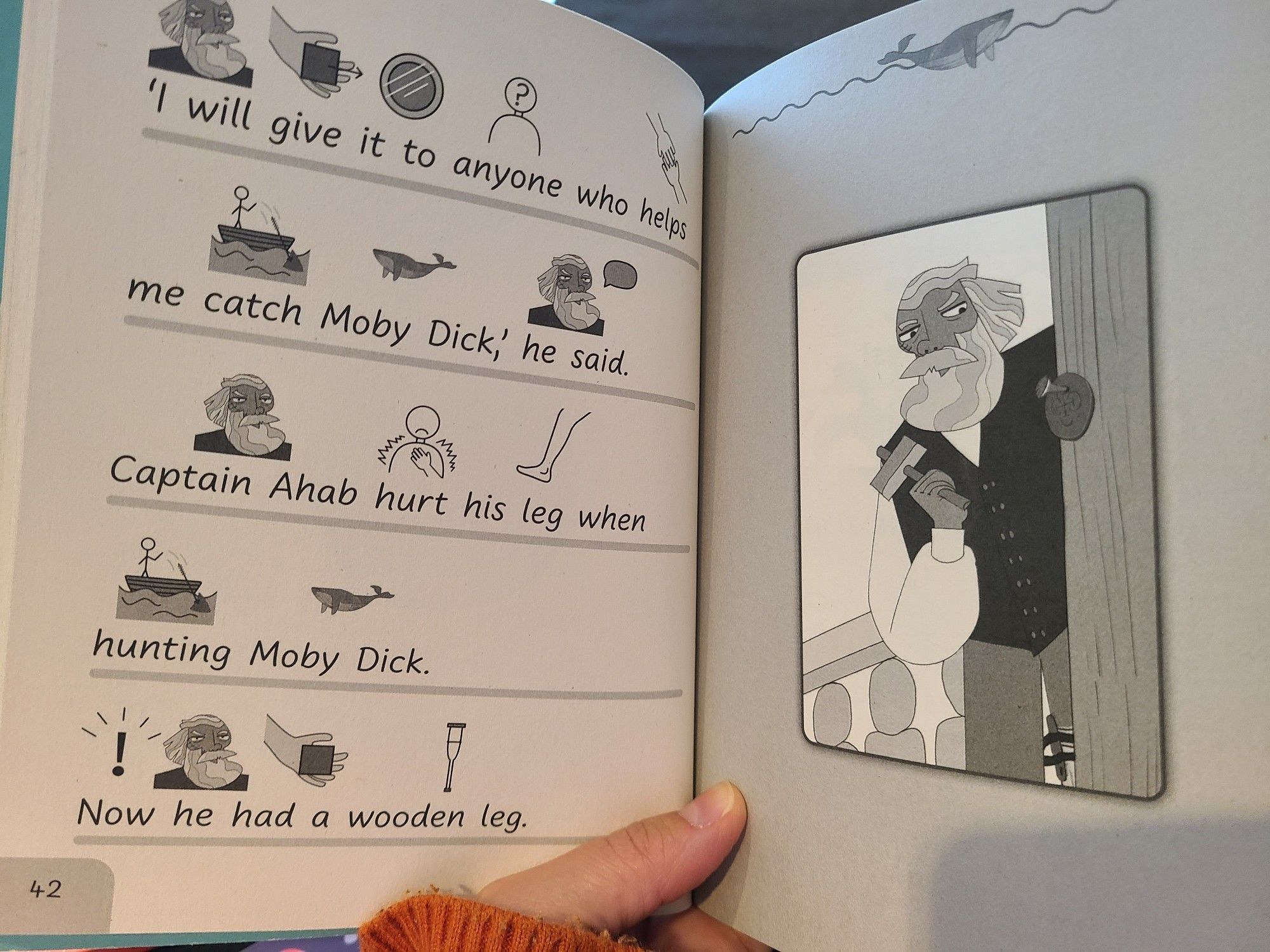 Pg 42 in the Symbolised Classics edition of Moby Dick. Shows brief text with symbols on the left and an illustration on the right. Same part of the story as pg42 in the Easier Classics