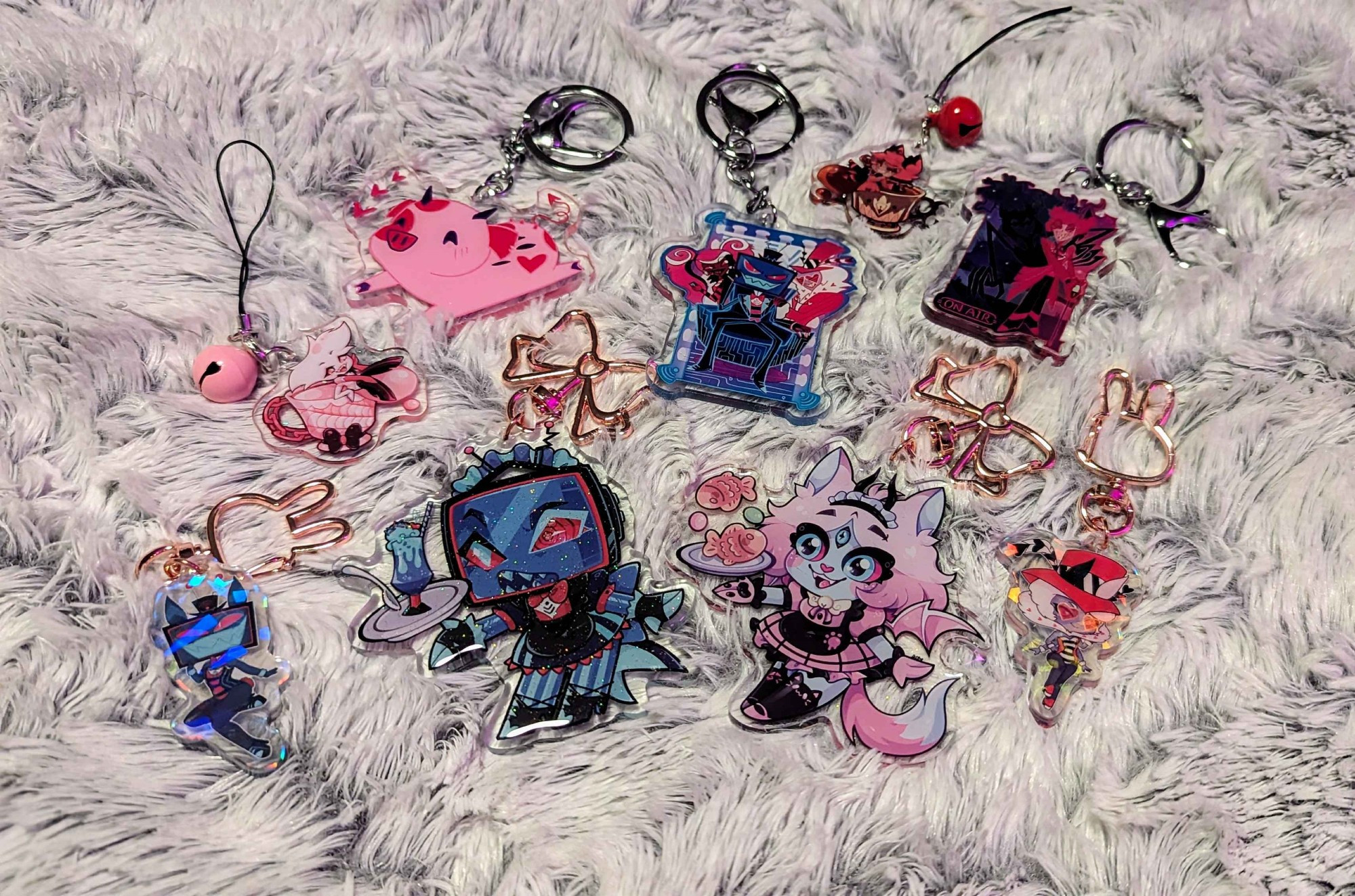 Vox bunny girl charm, Vox maid charm, Vees charm, Angel tea cup charm, Fat Nuggets charm, Alastor tea cup charm, Alastor charm, Valentino bunny girl charm, Emberlynn Pinkle (sinner form) charm