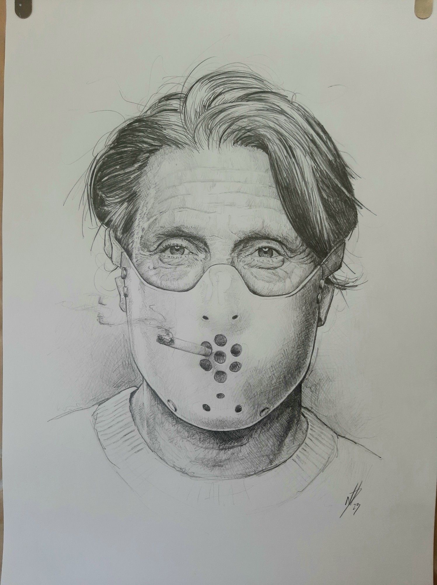 Pencil drawing of Mads Mikkelsen wearing a Hannibal mask and smoking a cigarette 