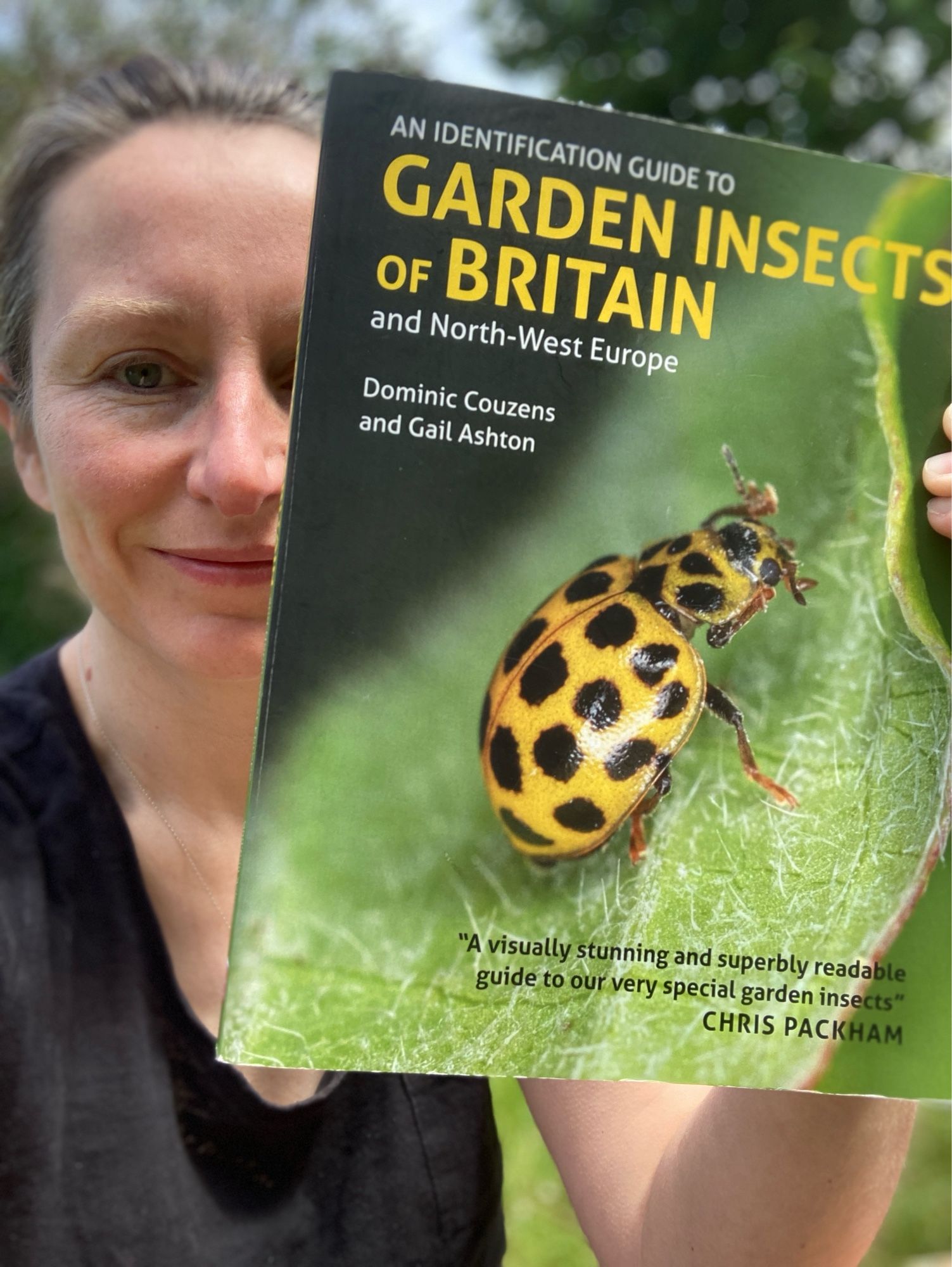 Gail Ashton holds up a copy of her book ‘An Identification Guide to Garden Insects’.