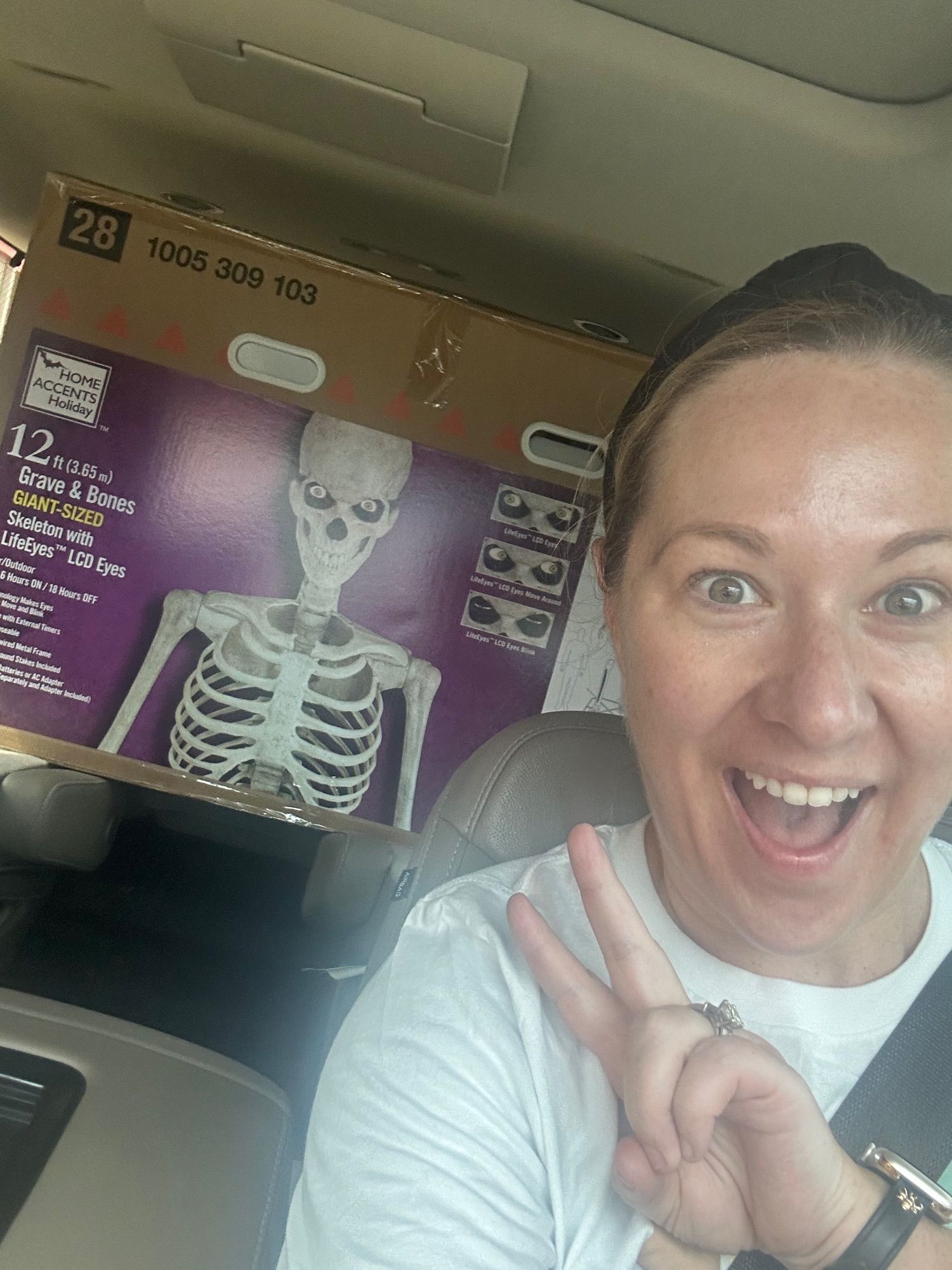 Selfie with my new 12 foot skeleton stuffed in the back of the car