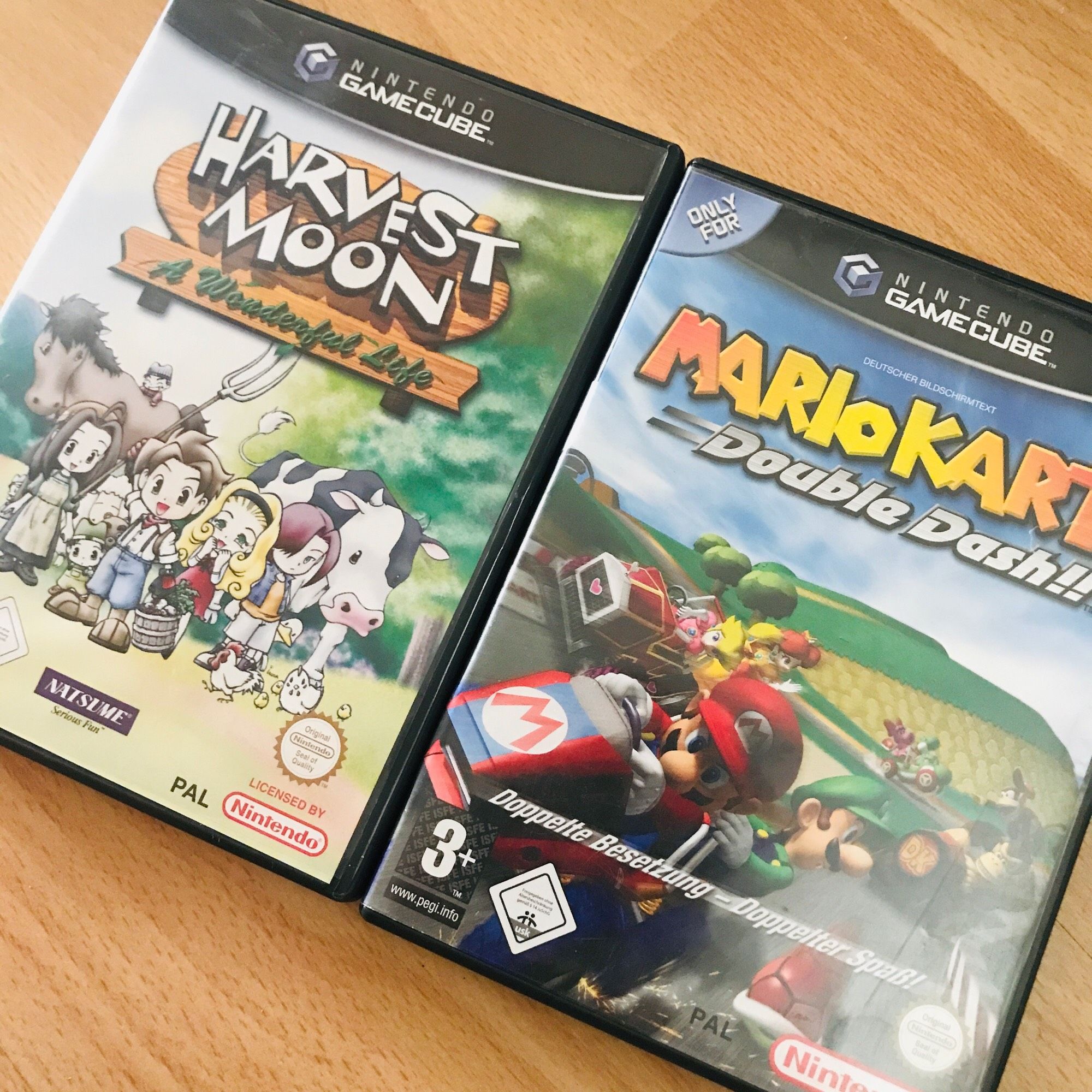 A copy of Harvest Moon A Wonderful Life and Mario Kart Double Dash, both for Nintendo GameCube.