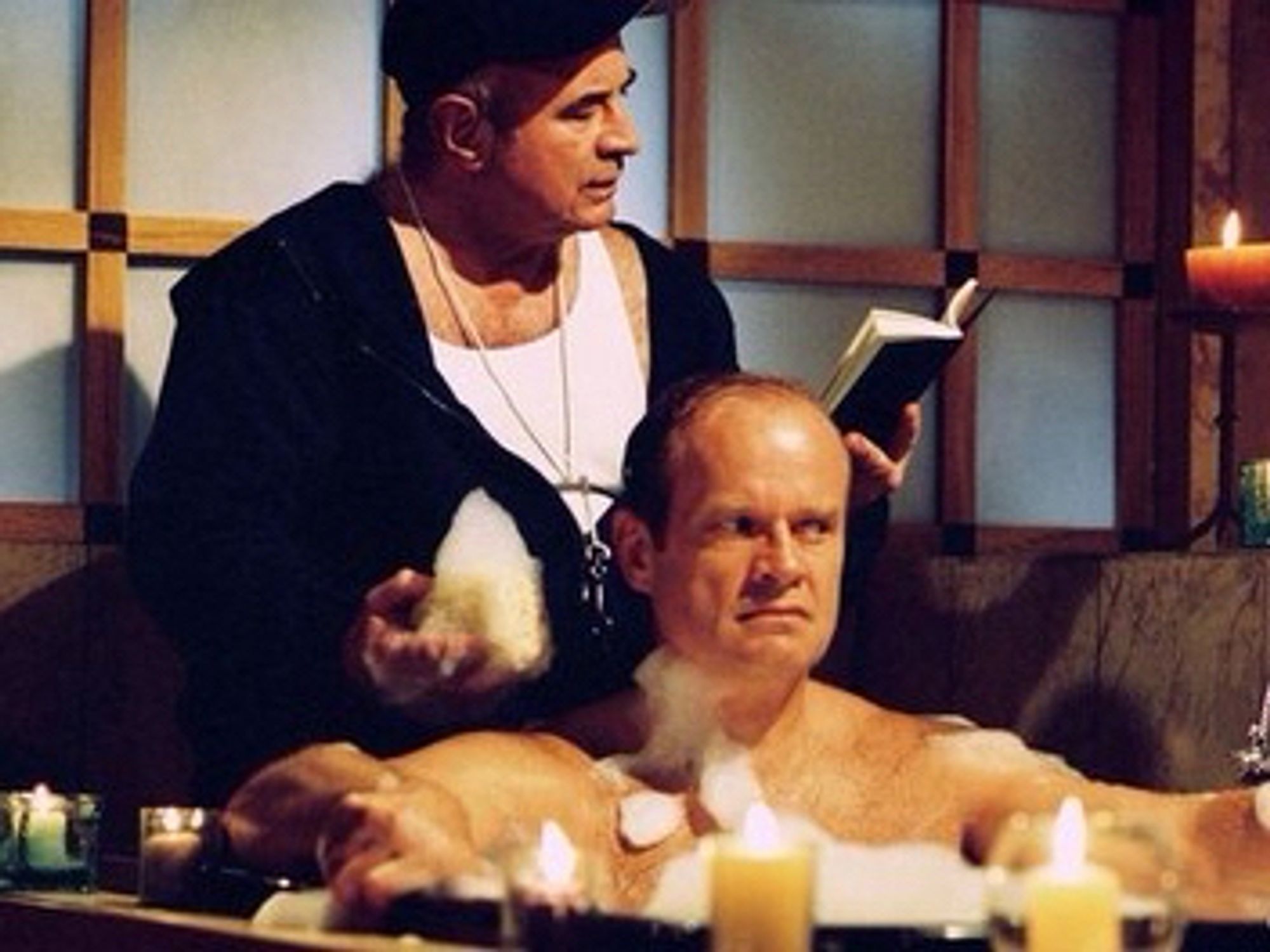 Bob Hoskins in Frasier giving him a back rub while he lays in the bath.