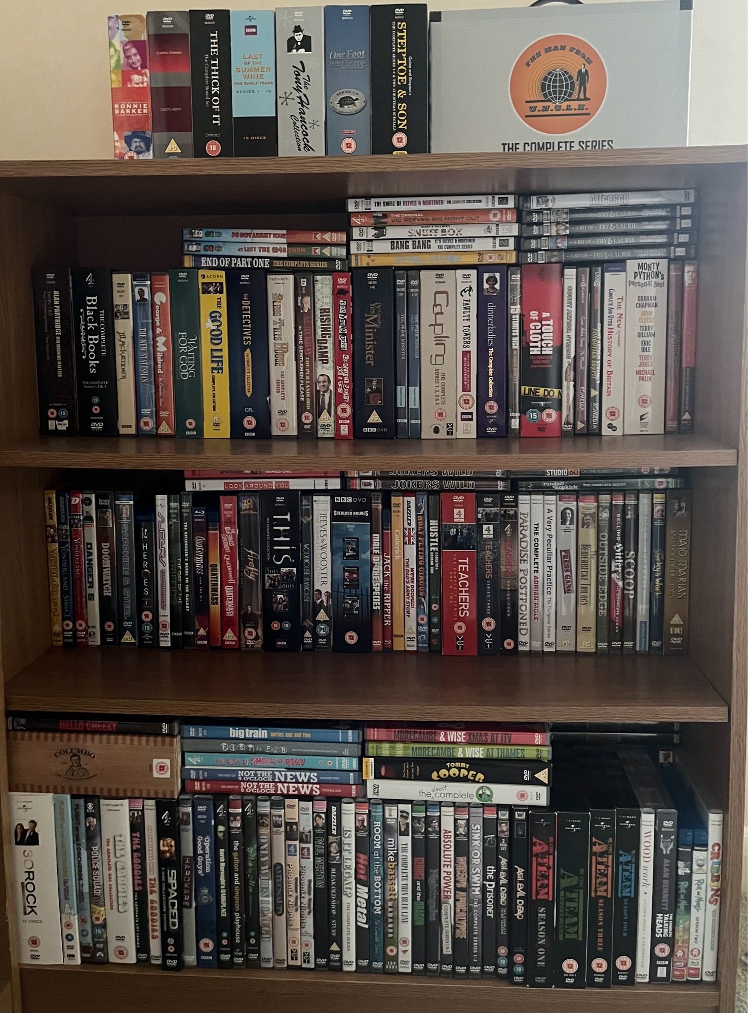 Another bookcase full of DVDs and Blu-Rays with some more box-sets on the top.