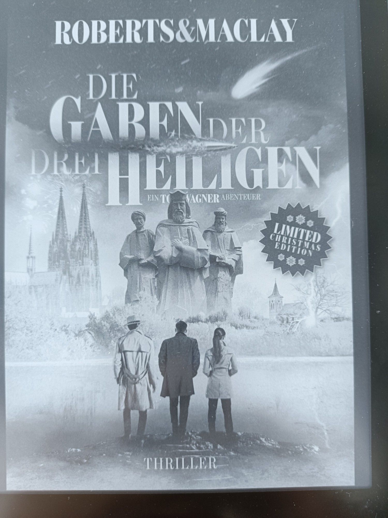 Buchcover "Die Gaben der drei Heiligen" von M.C. Roberts & R.F. Maclay (Tom Wagner Reihe Band 10)