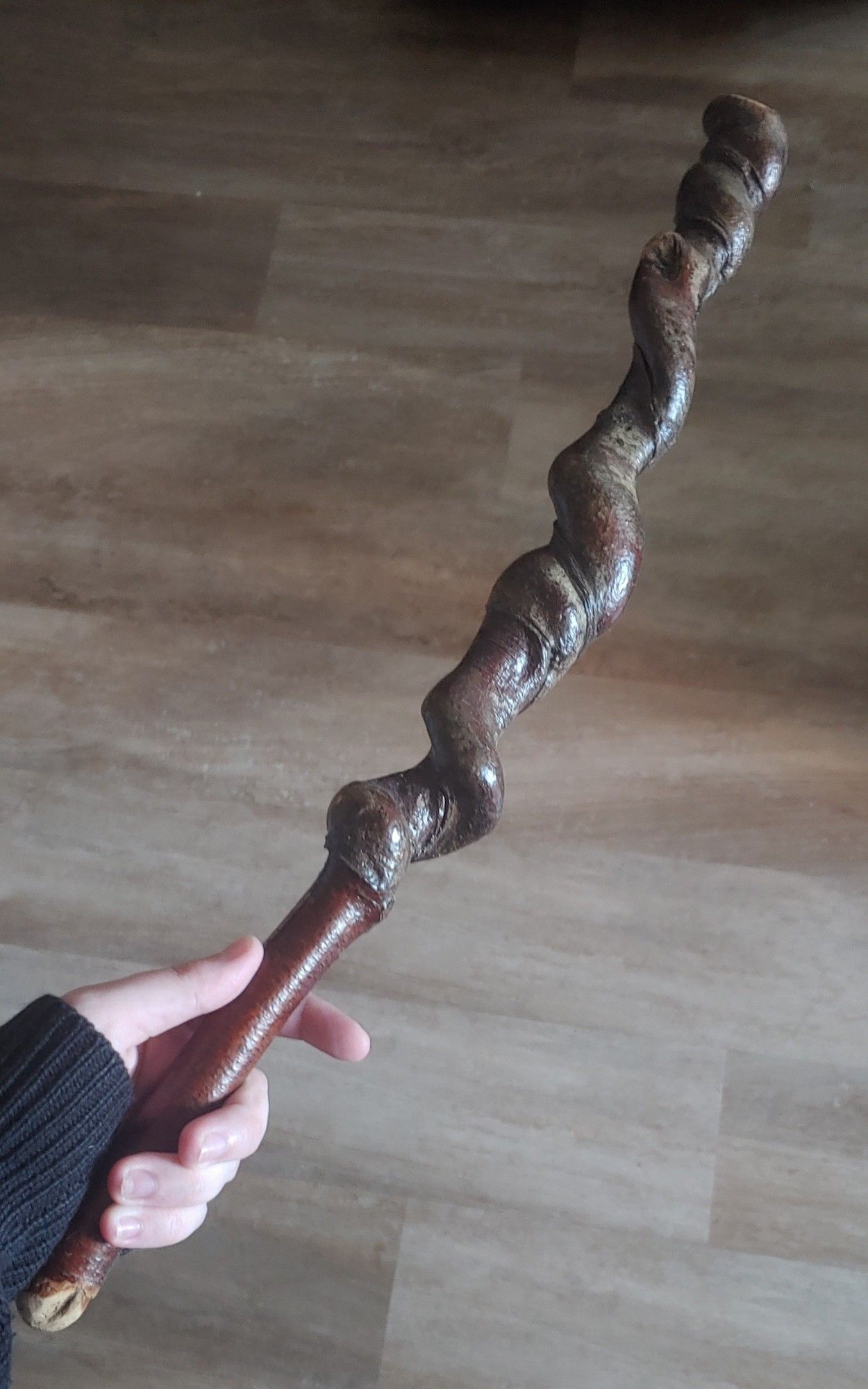 A stick that is straight for about a fourth of its length the rest is twisty