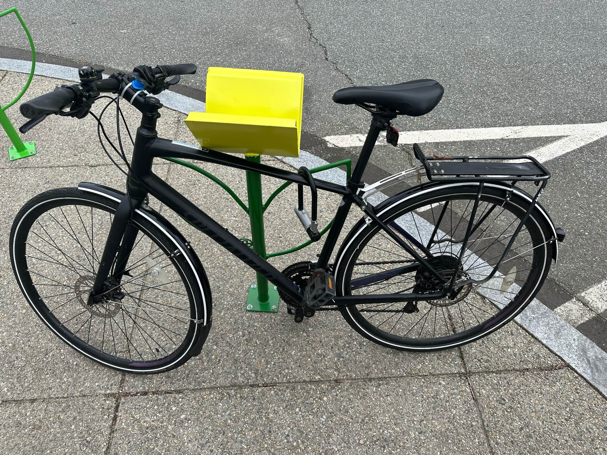 Artistic bike rack at a library. It’s a book